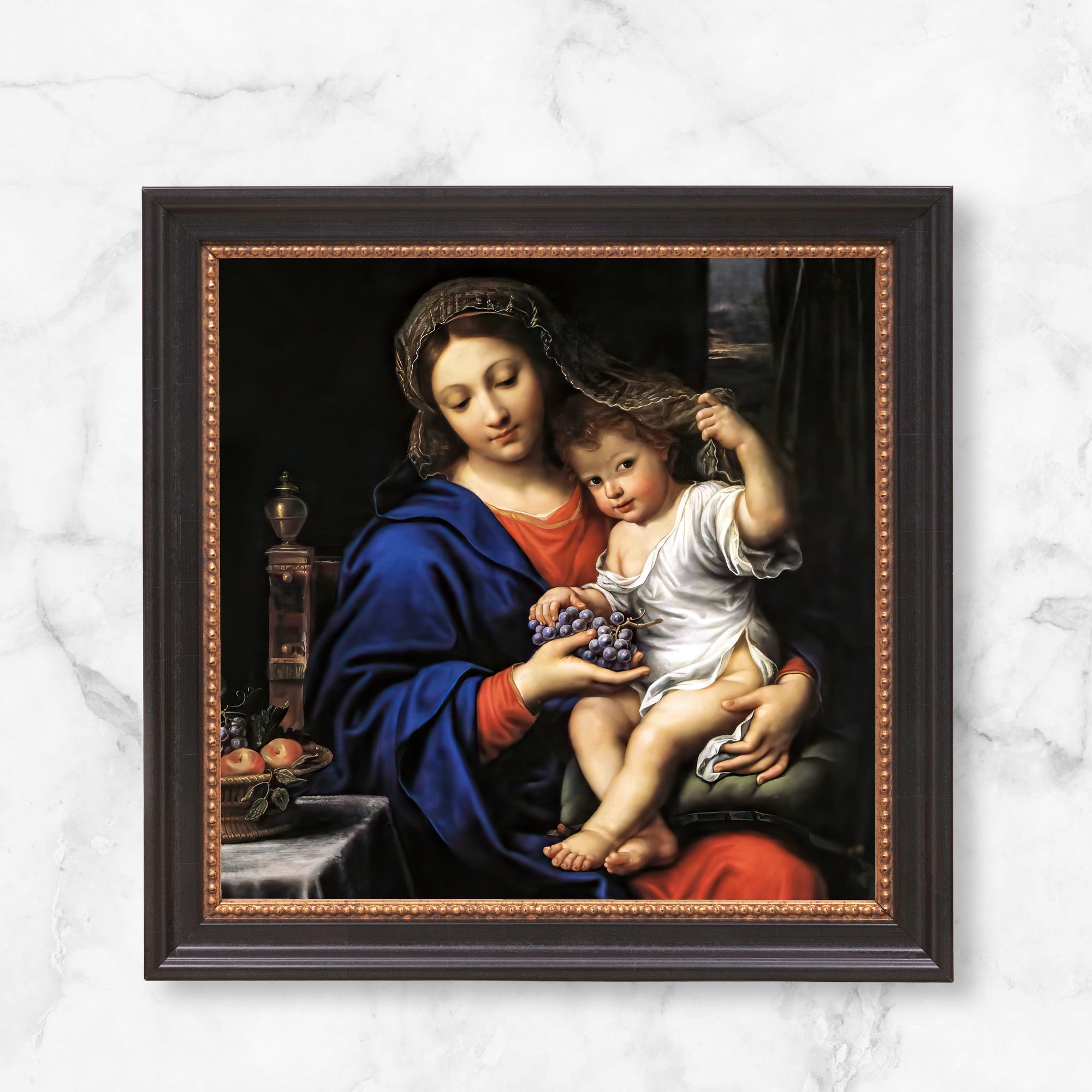 Framed "Madonna and Child" print. Dark brown wood frame with gold accents around a Renaissance-style painting.