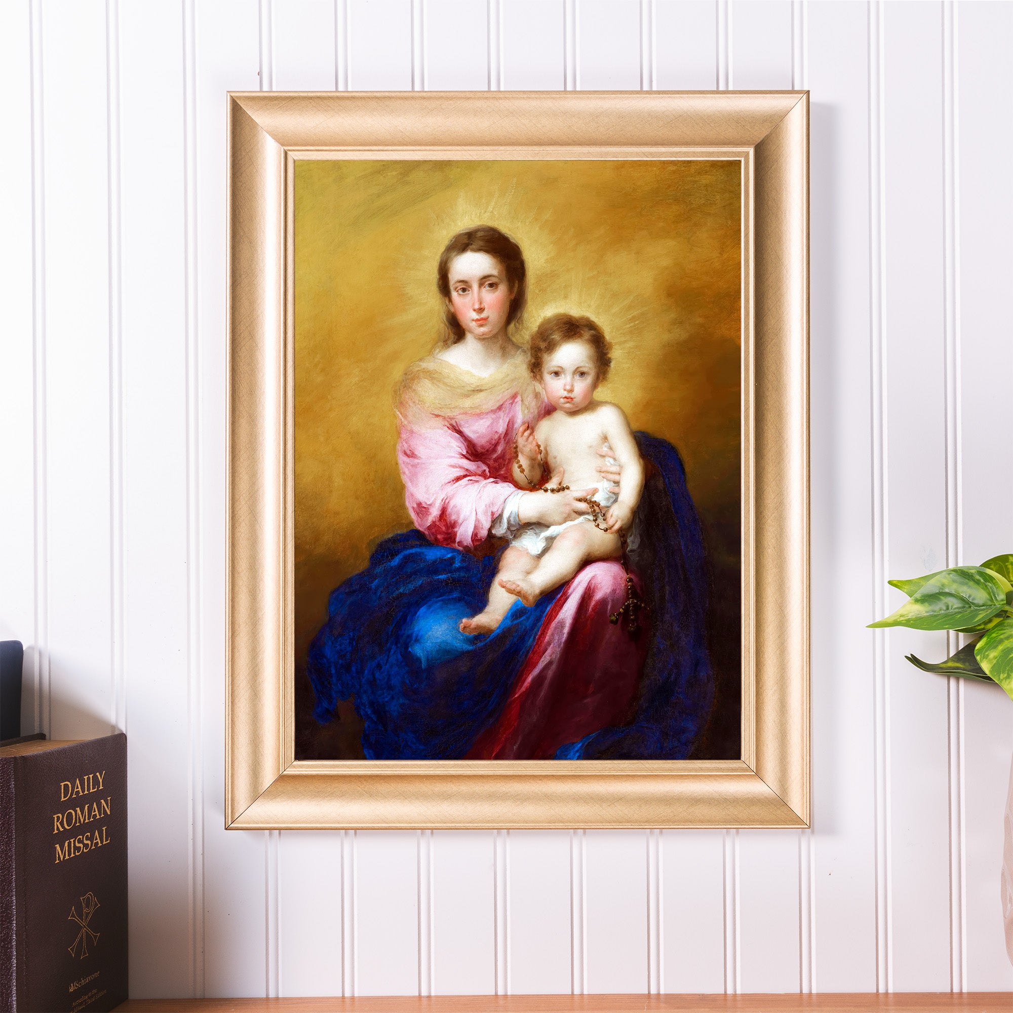 Framed art print of the Virgin Mary and baby Jesus in a golden frame.