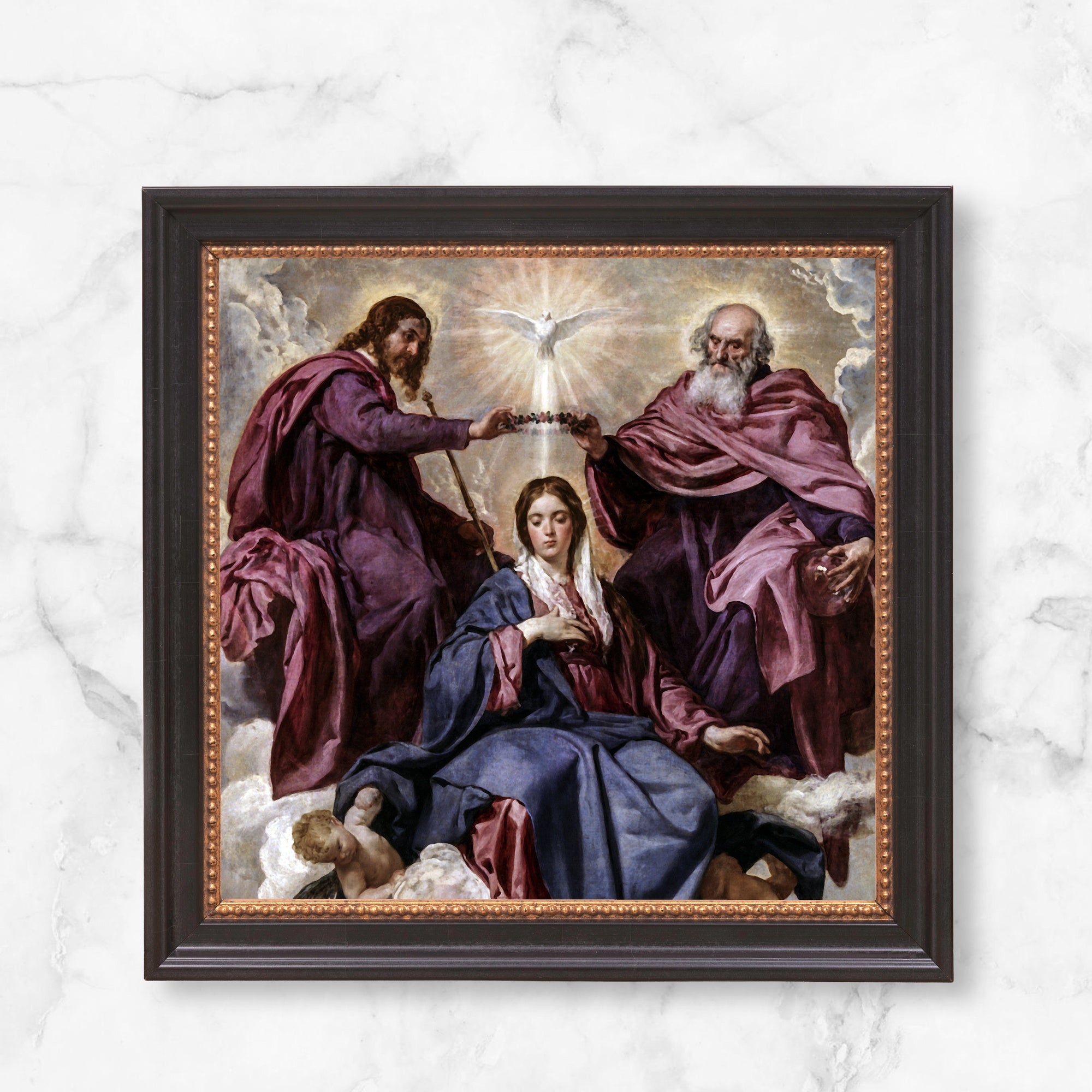 Framed coronation of Mary print; painting of Mary being crowned by God and Jesus under dove, in blues and purples.