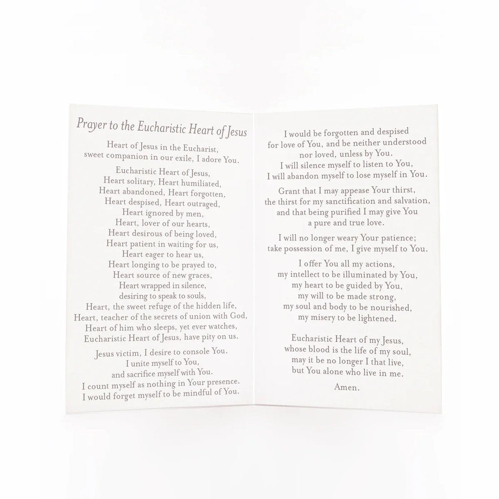 Prayer card with the "Prayer to the Eucharistic Heart of Jesus" printed in black ink on white paper, arranged in two columns.