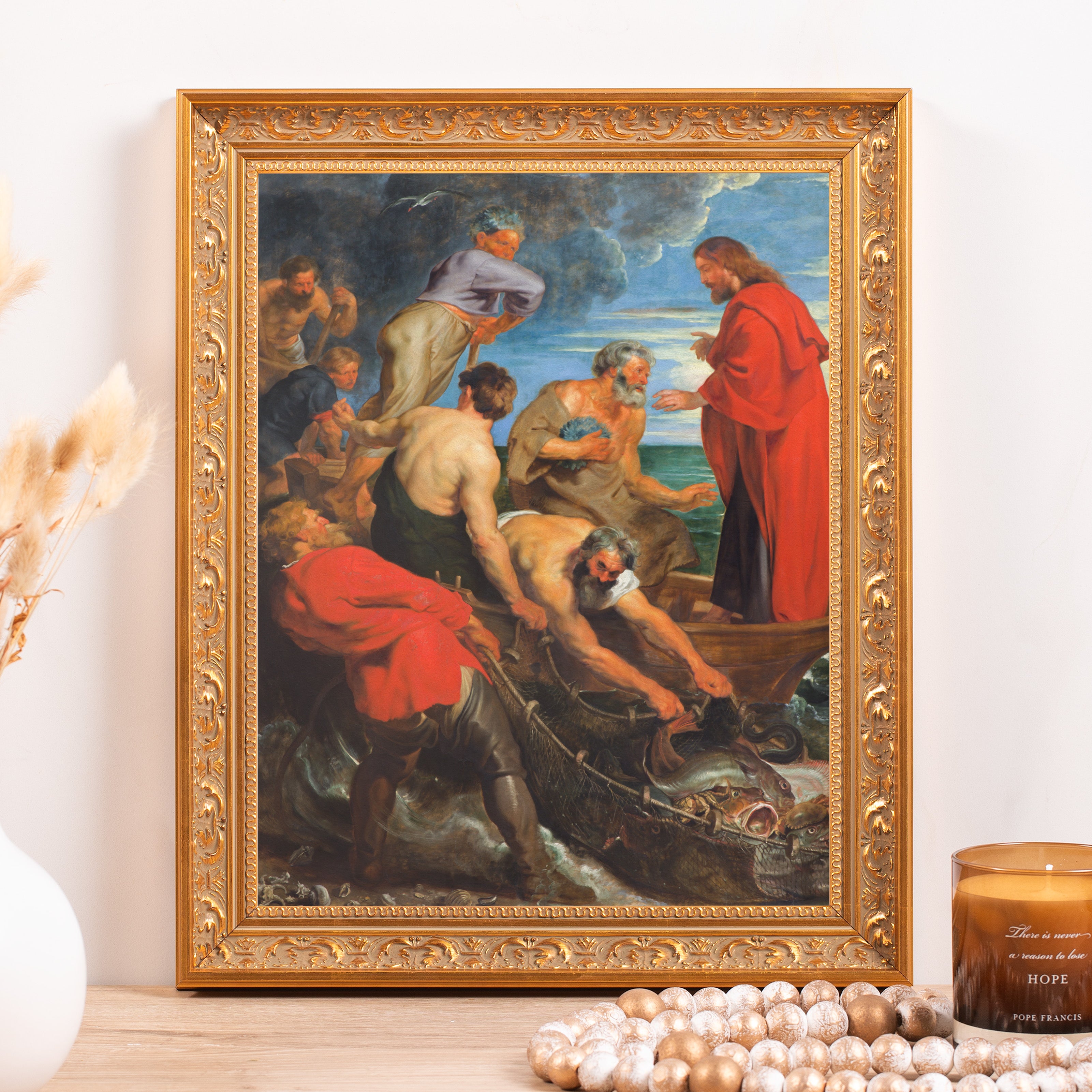 Framed painting depicts Jesus telling fishermen to cast their nets; gold frame.