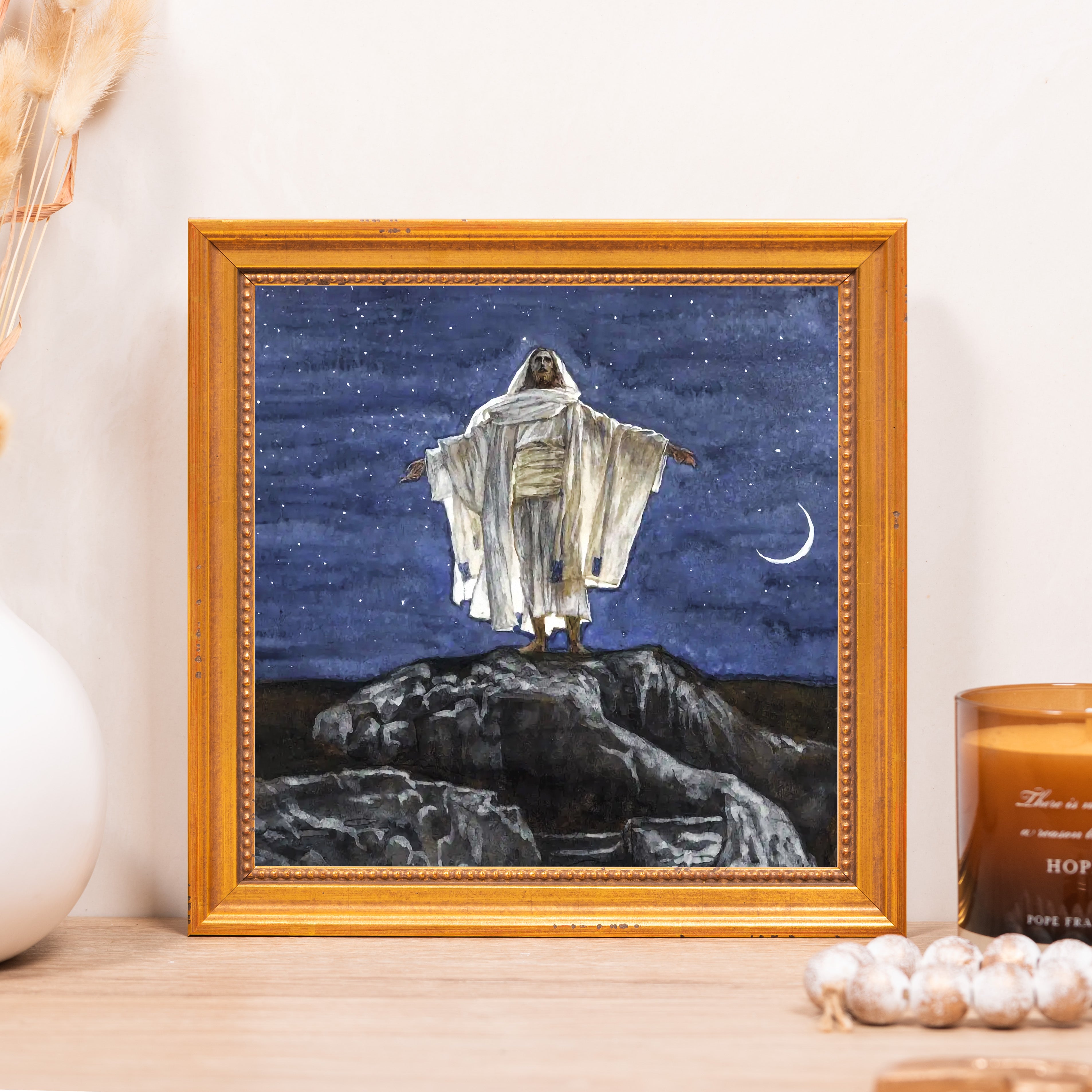 Framed Painting of Jesus standing on a hill at night, framed in gold.