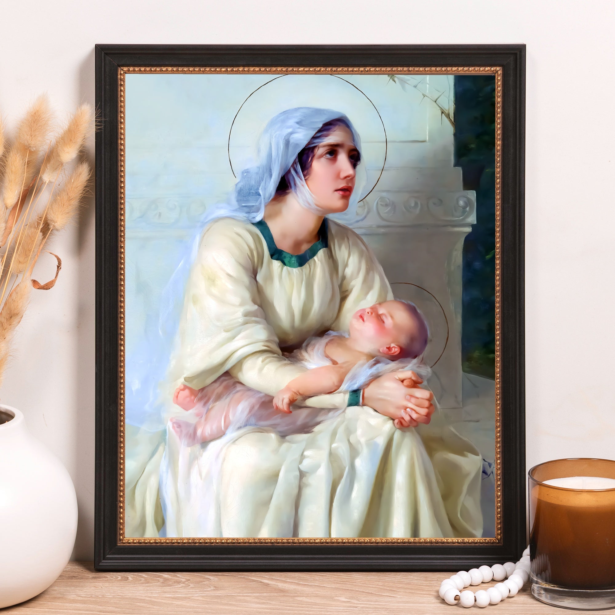 Framed fine art print of Mary and baby Jesus in black and gold frame.