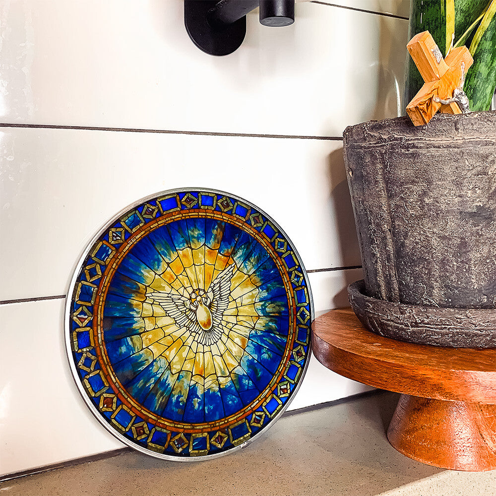 Stained-glass-style window cling featuring a white dove against a blue and yellow background.