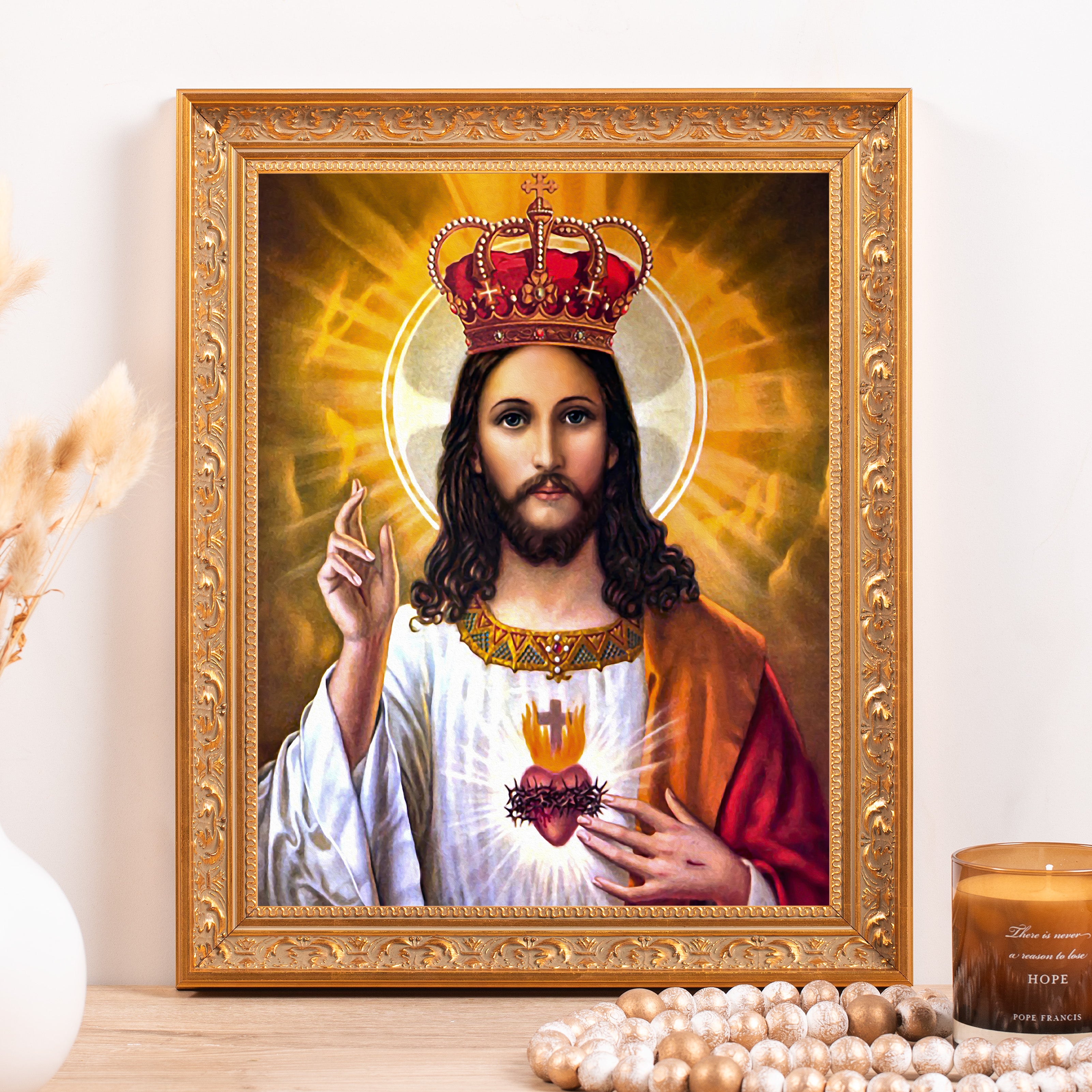 Framed portrait depicts Jesus wearing a crown, gold ornate frame, religious artwork.