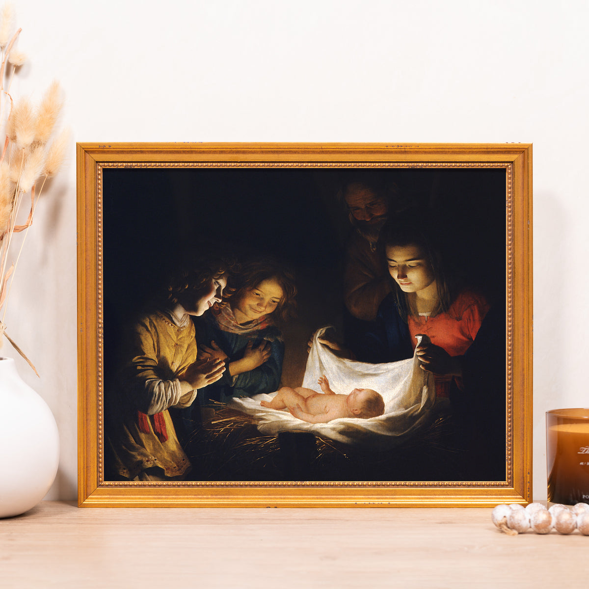 Framed Nativity print. Golden frame; dark colors, oil painting style.