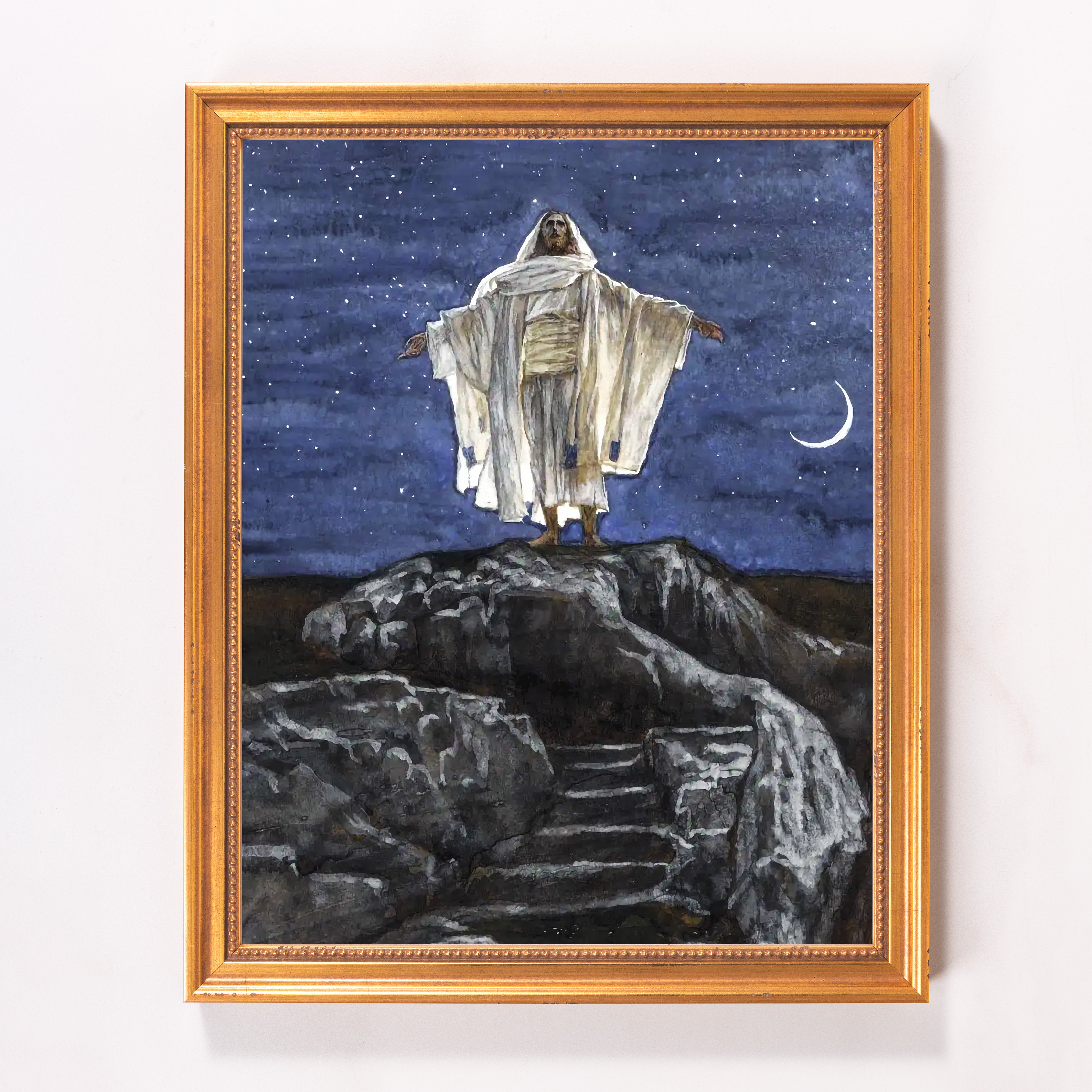 Framed art print showing Jesus on a rock at night with a blue starry background.