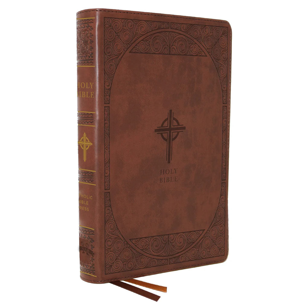 Holy Bible is brown leather with a Celtic cross and ornate frame.