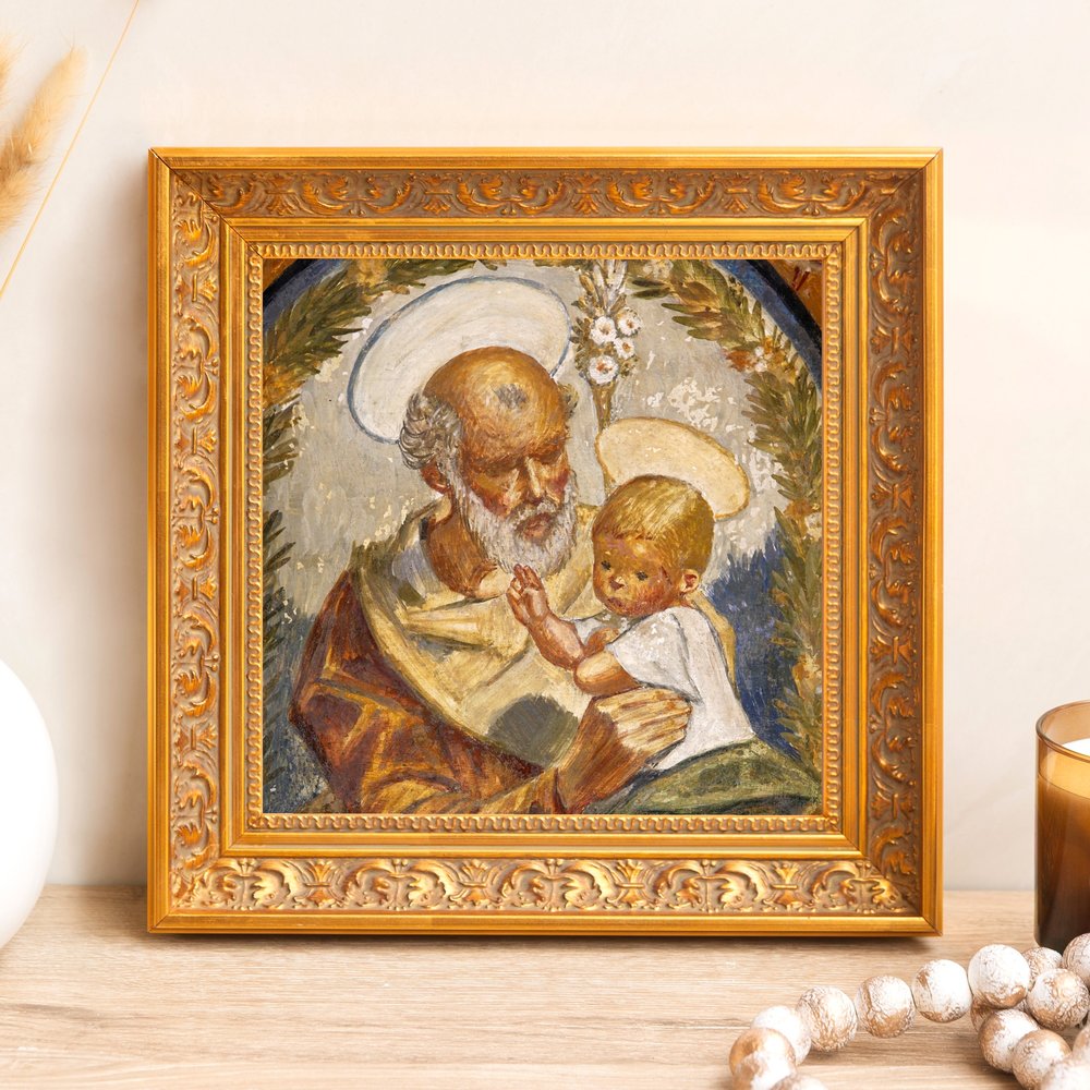 Framed painting of Joseph and baby Jesus in ornate gold frame for wall decoration.