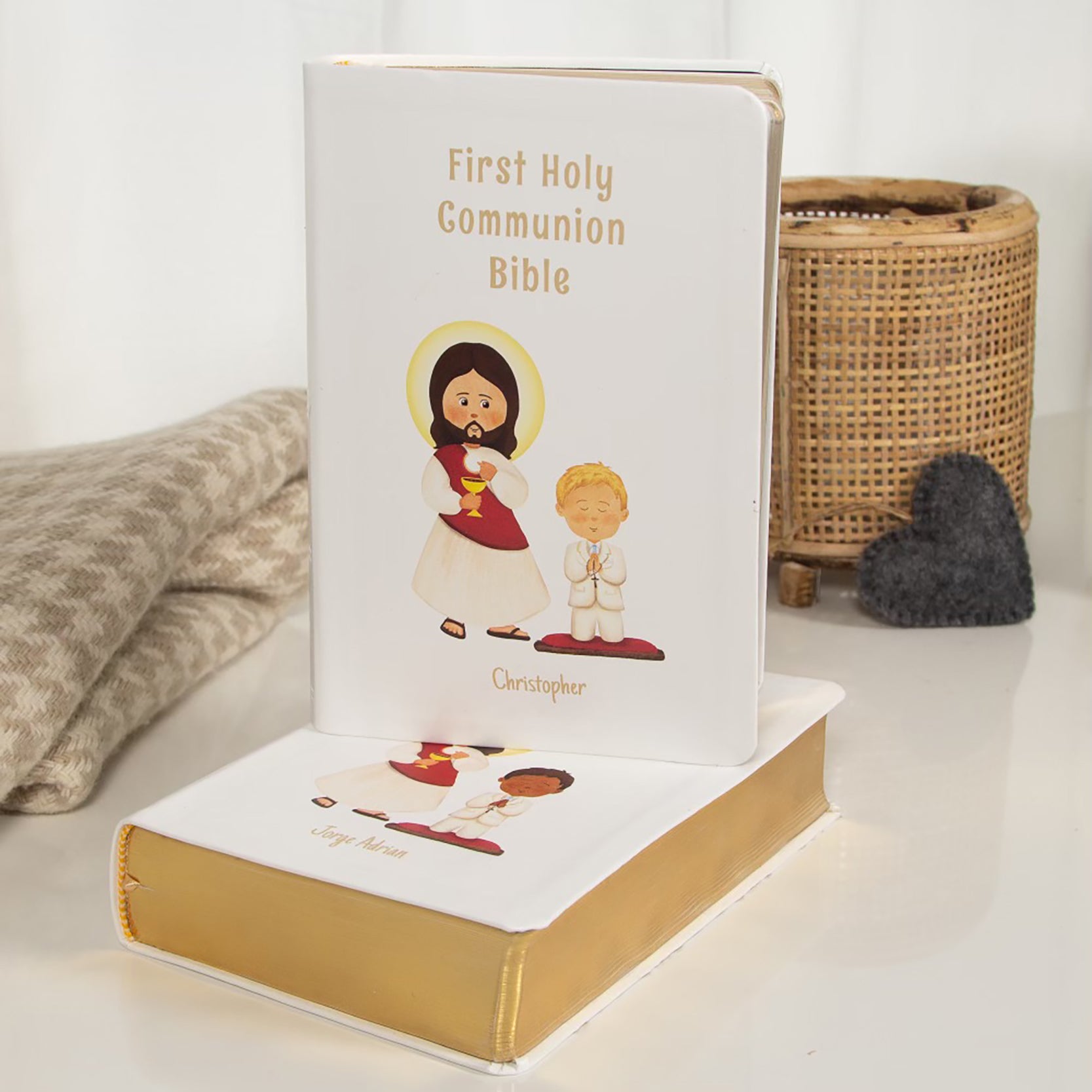 First Communion Bible with white cover, gold trim, and child/Jesus illustration.