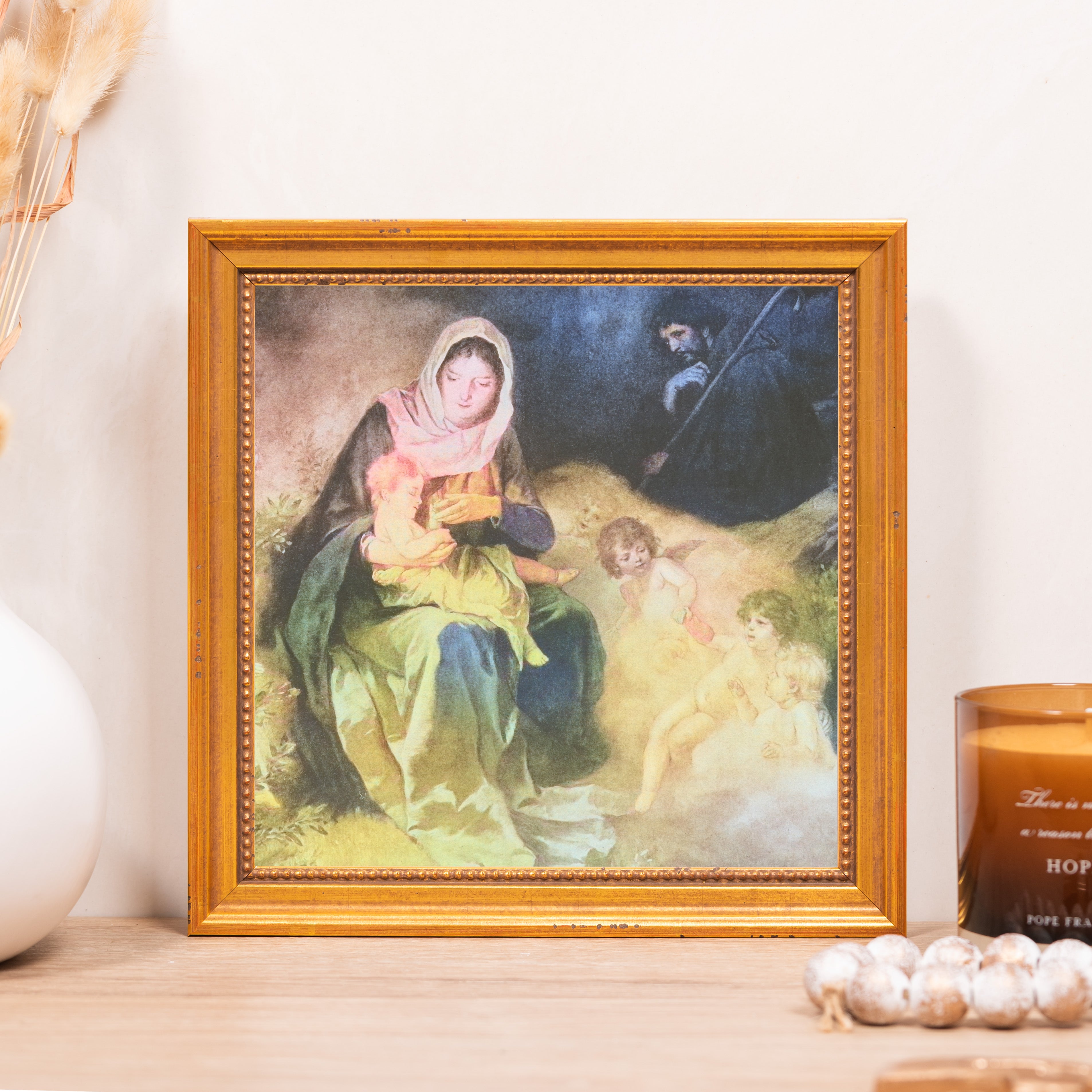 Framed print of Madonna and Child in gold tone frame.