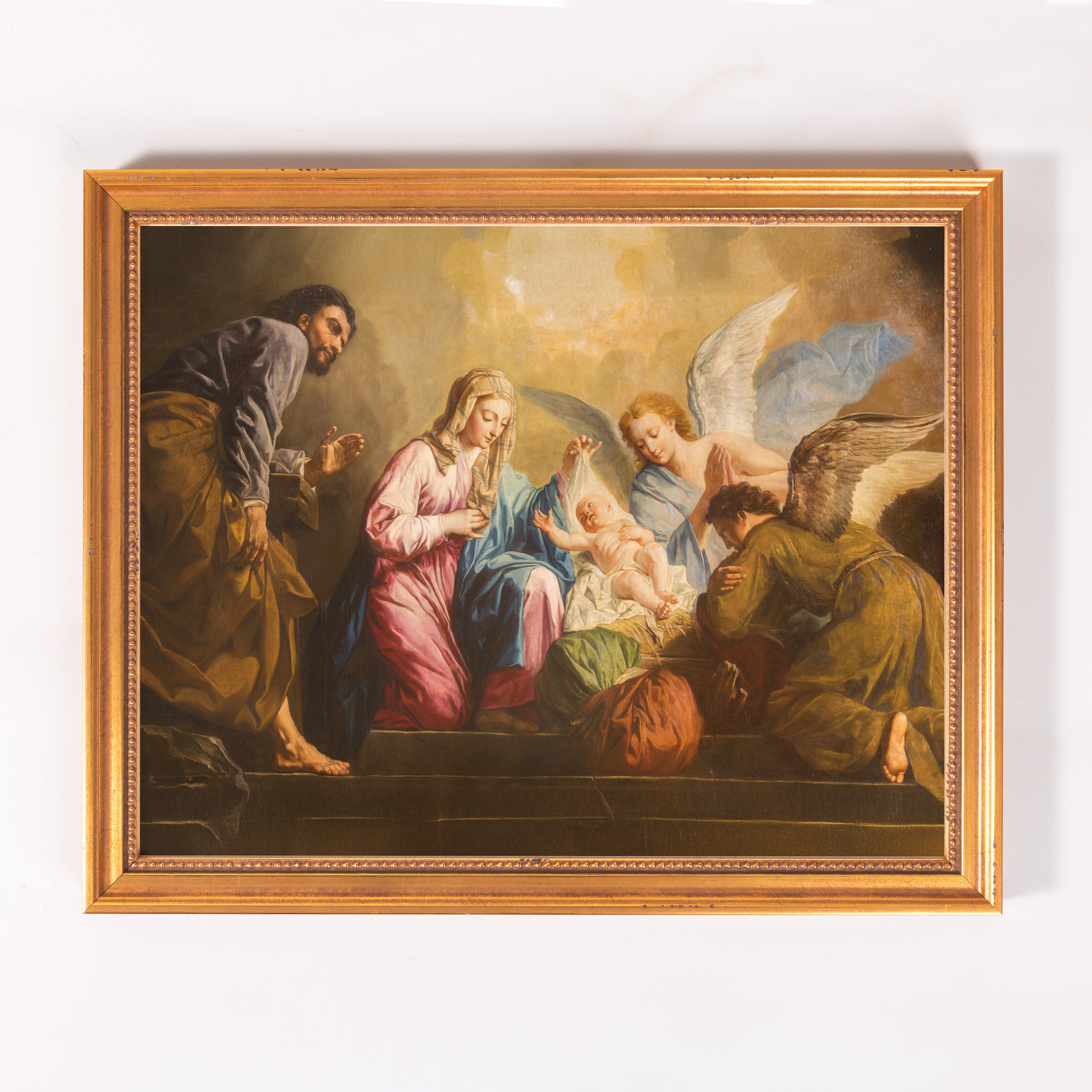 Framed painting depicts the Nativity with gold frame.