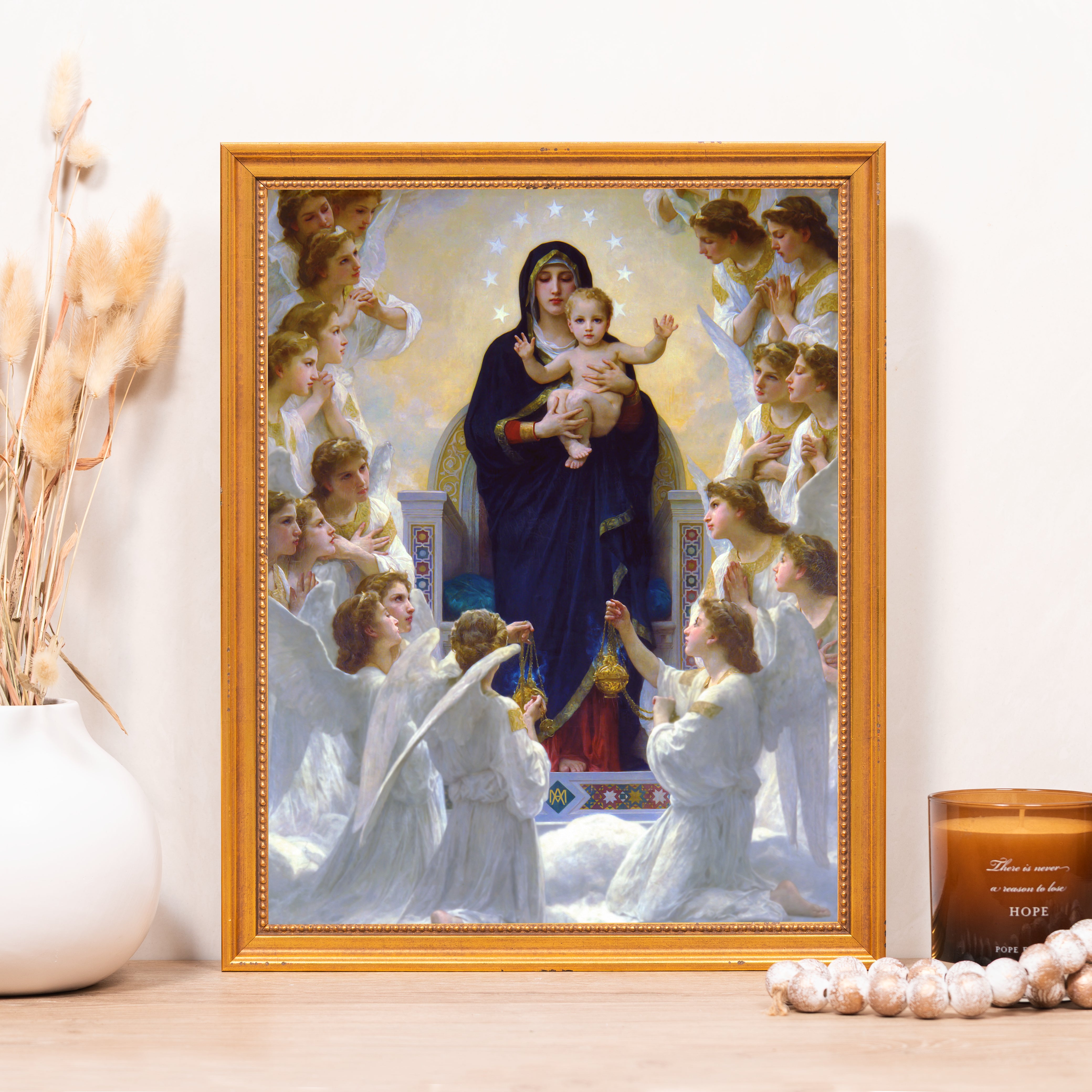 Framed painting of Madonna of the Angels: Virgin Mary with Christ child surrounded by angels in a gold frame.