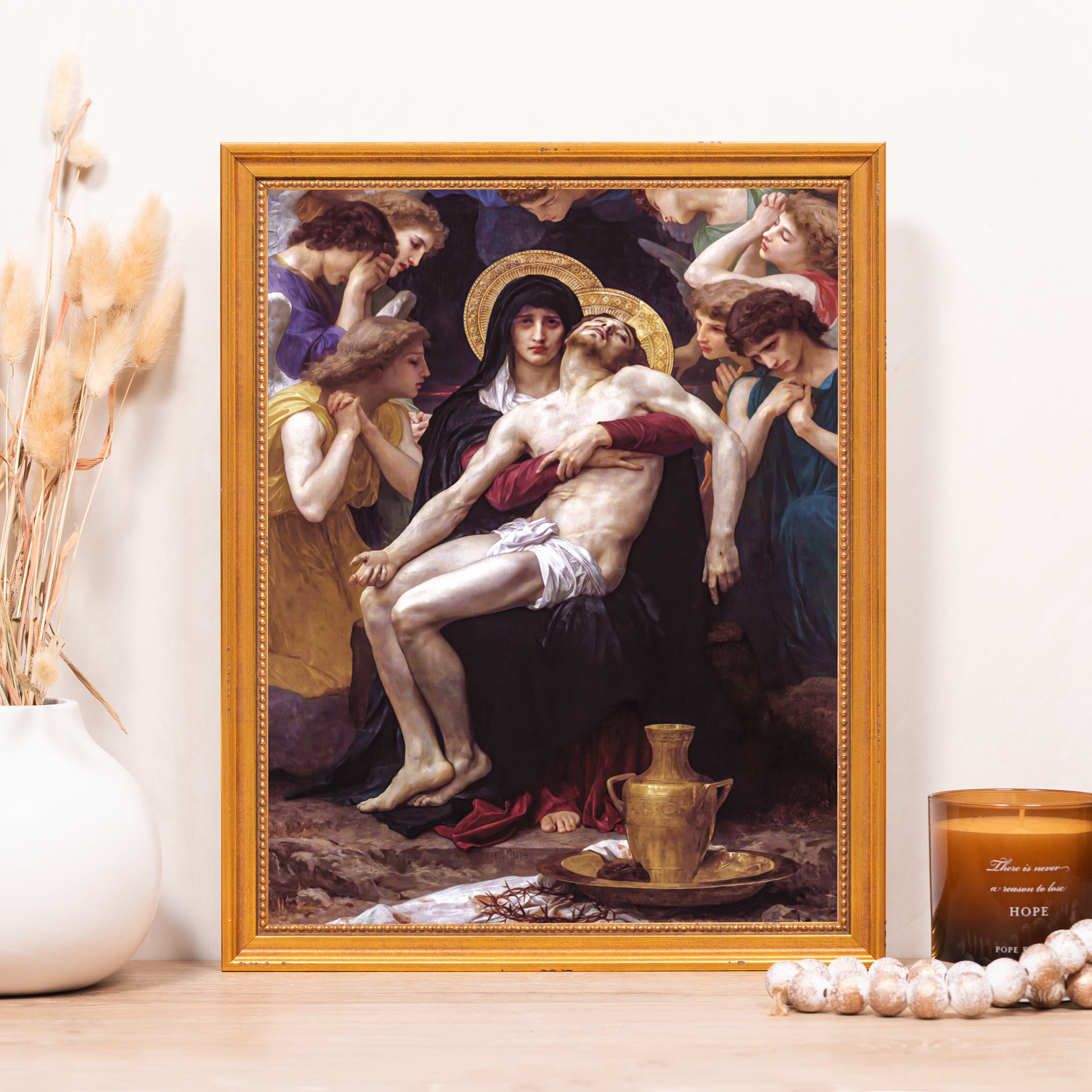 Framed "Pieta" print with ornate gold frame shows Mary holding the dead Jesus, surrounded by angels.