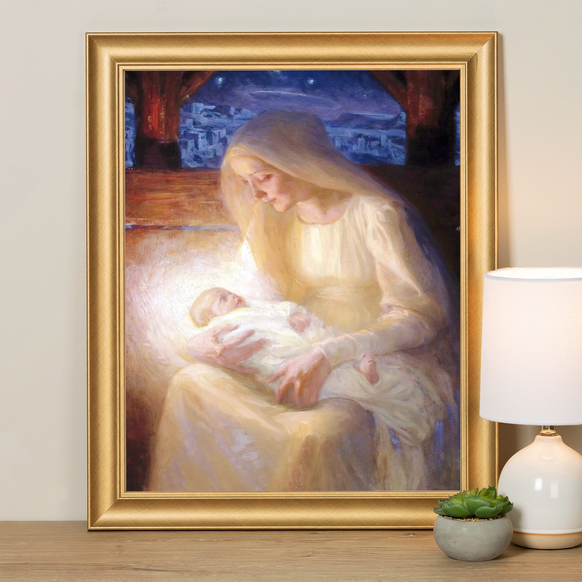 Framed art print of Madonna and Child in soft yellow hues, gold frame, for home decor.