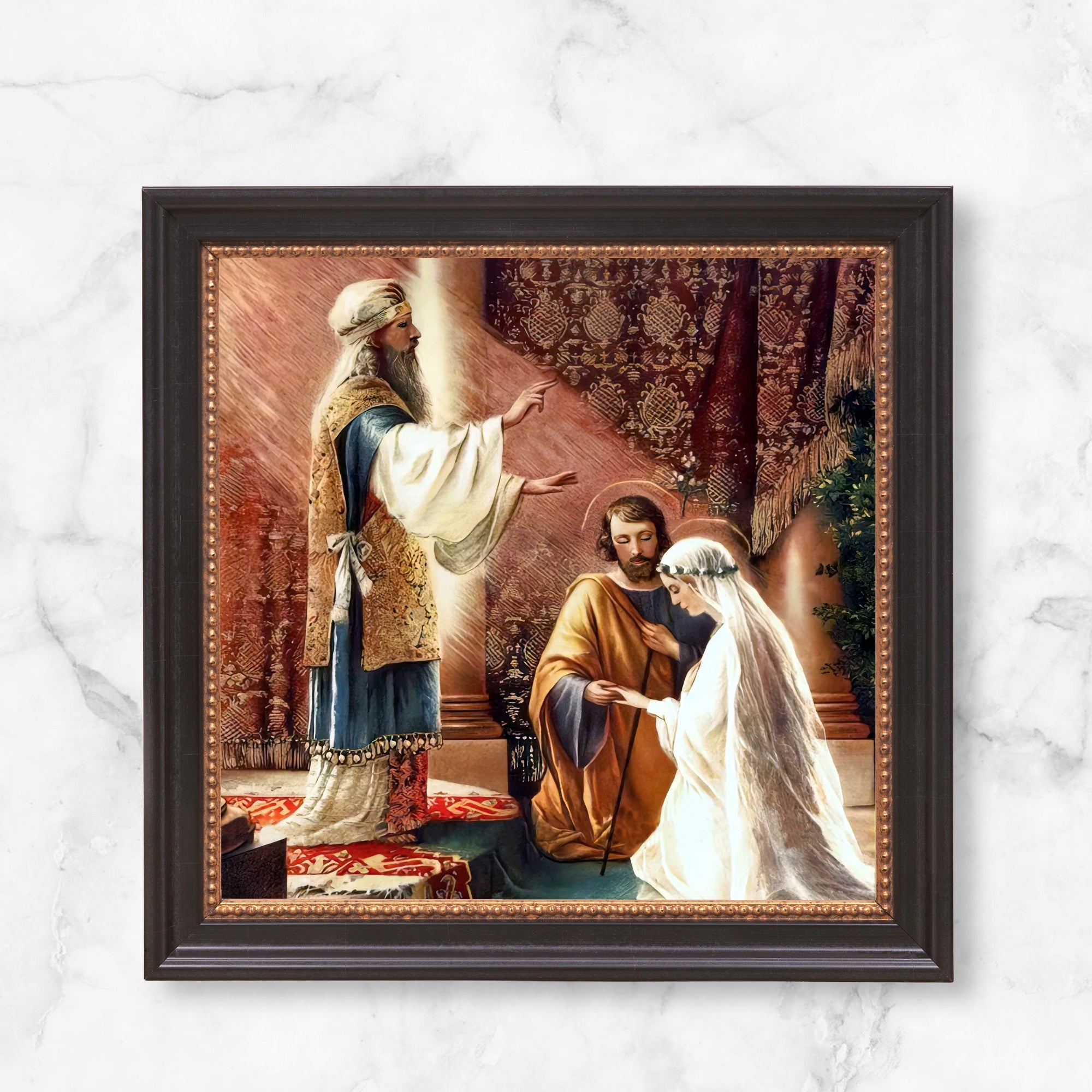 Framed marriage canvas art depicting bride and groom being married by a priest.