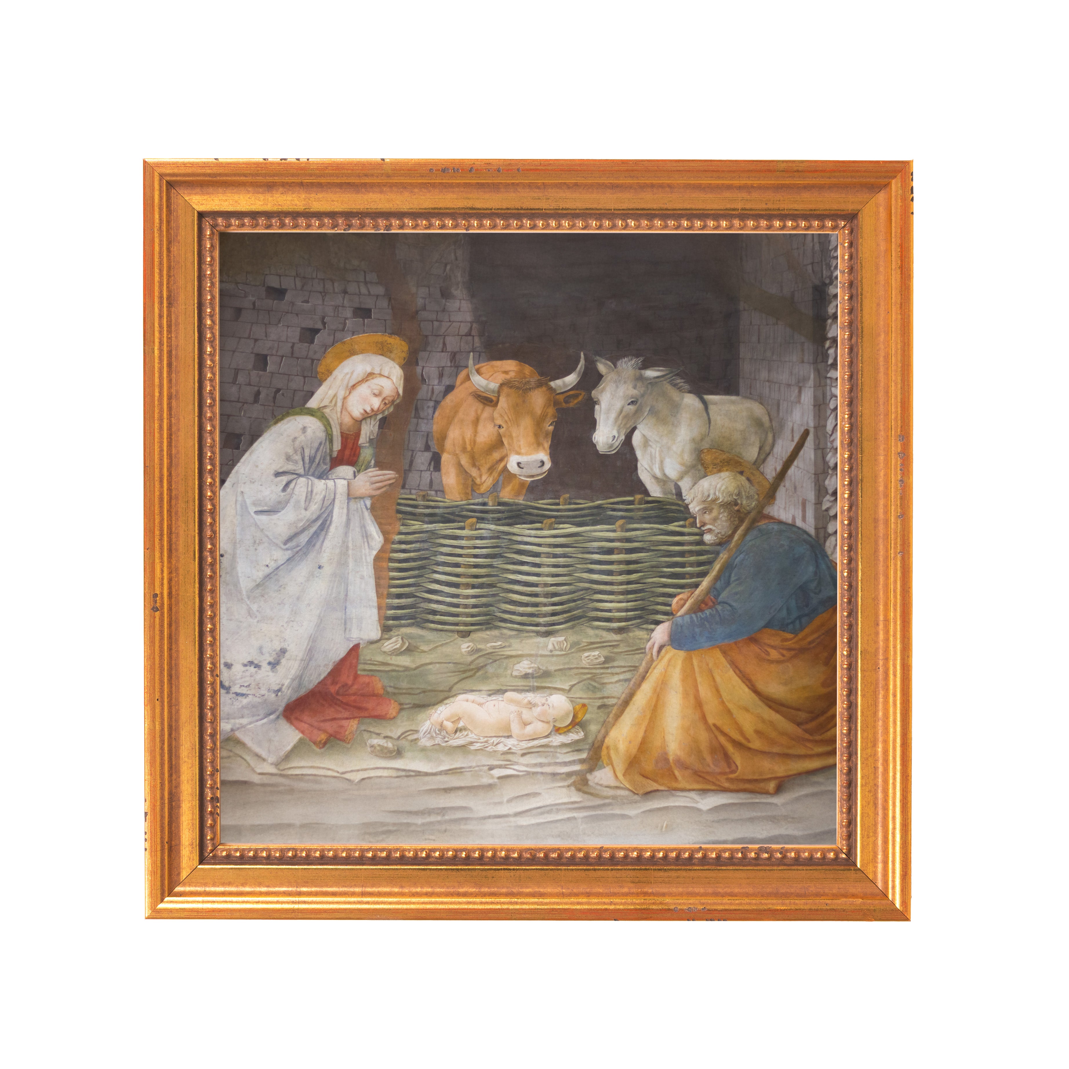 Framed Nativity scene painting depicts Mary, Joseph, Jesus, and animals in a stable with a gold frame.