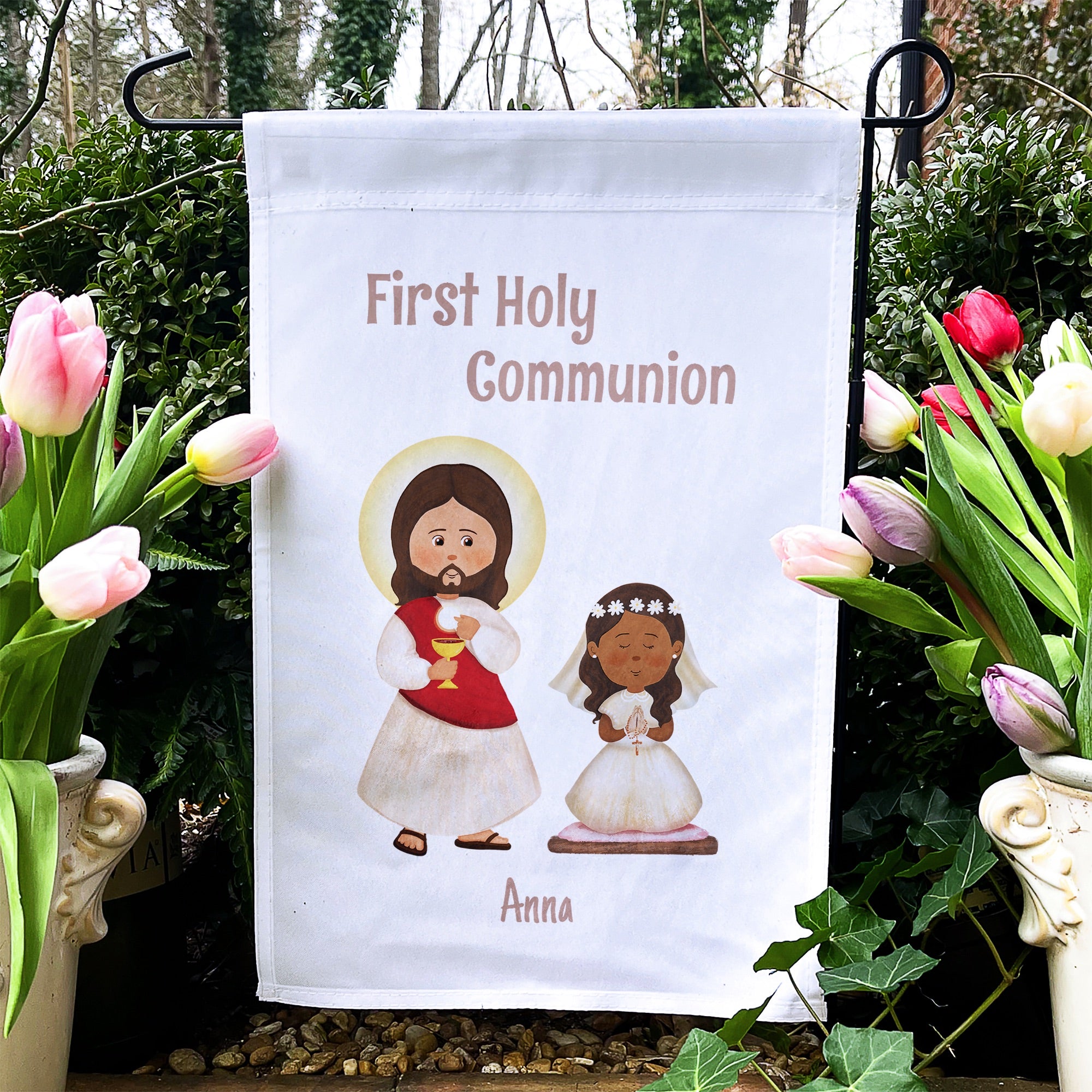 First Holy Communion garden flag with Jesus, girl in dress, and "Anna" name, on white fabric.