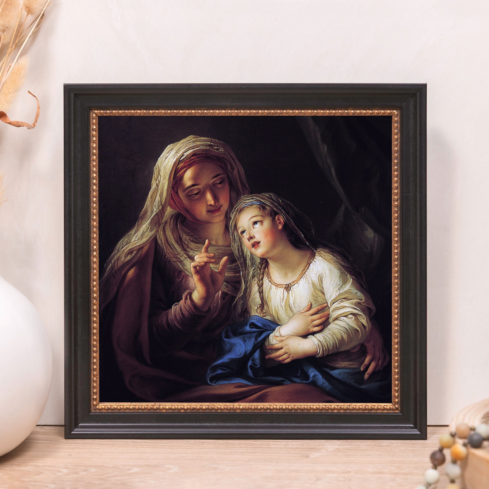 Framed art print featuring a classic religious scene with a black and gold frame.