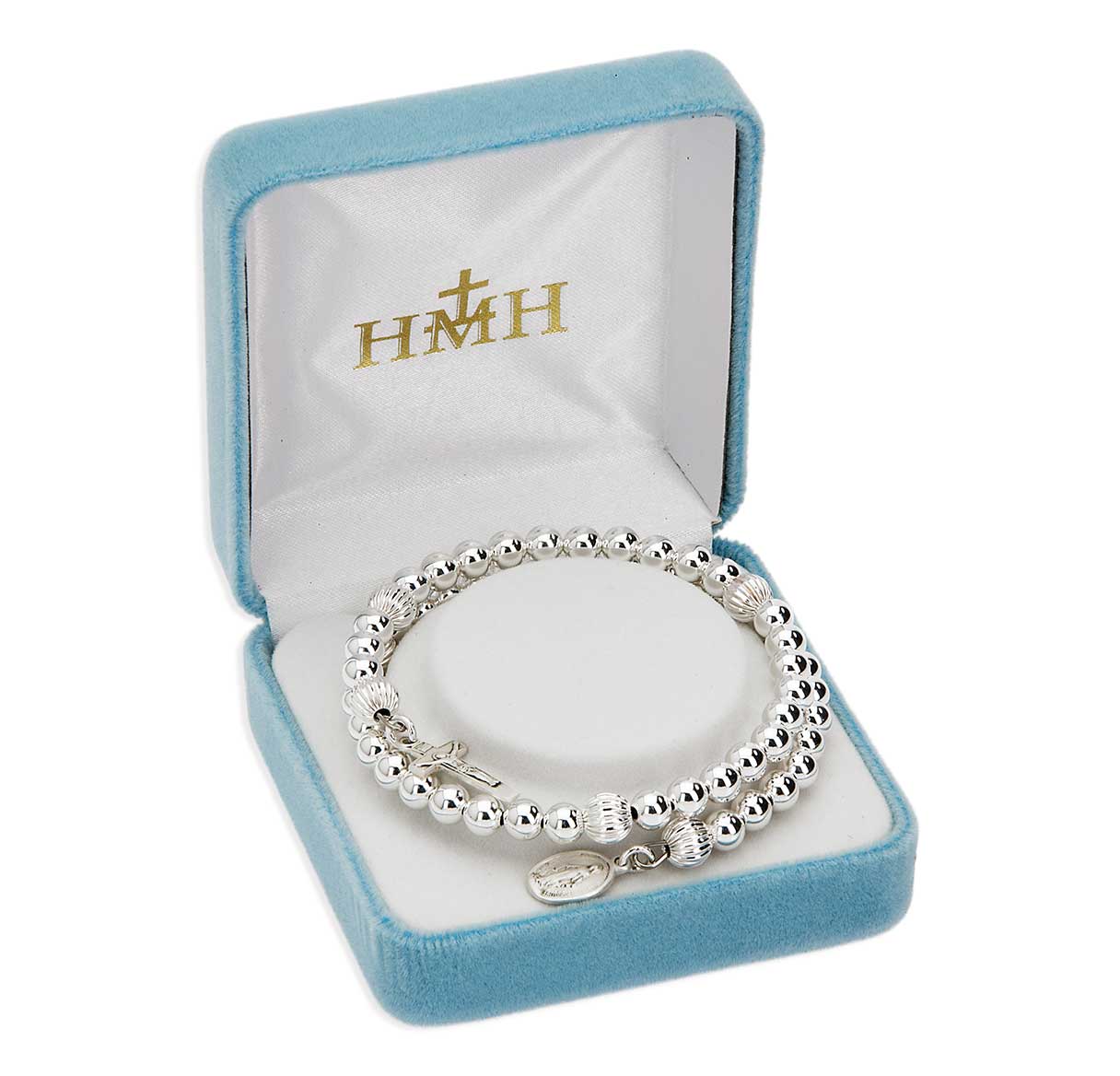 Religious silver beaded bracelet with a cross and pendant in a blue velvet gift box.