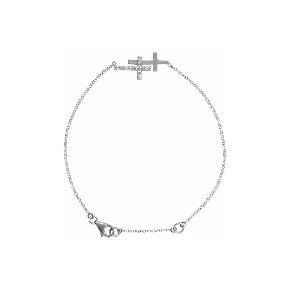 Silver bracelet with sideways cross design and diamond accents.