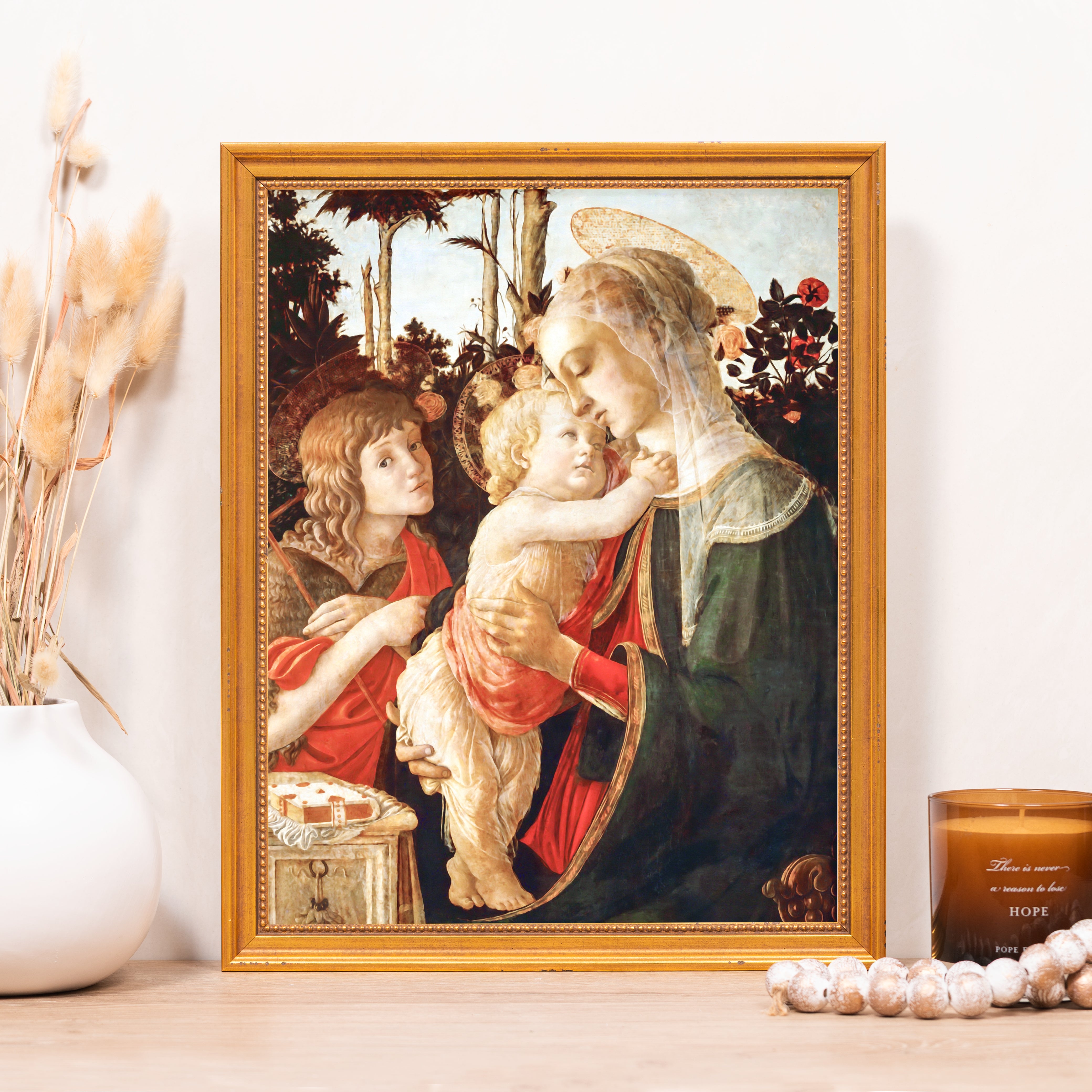 Framed print of Madonna and Child with an angel, in the Renaissance style with a gold frame.