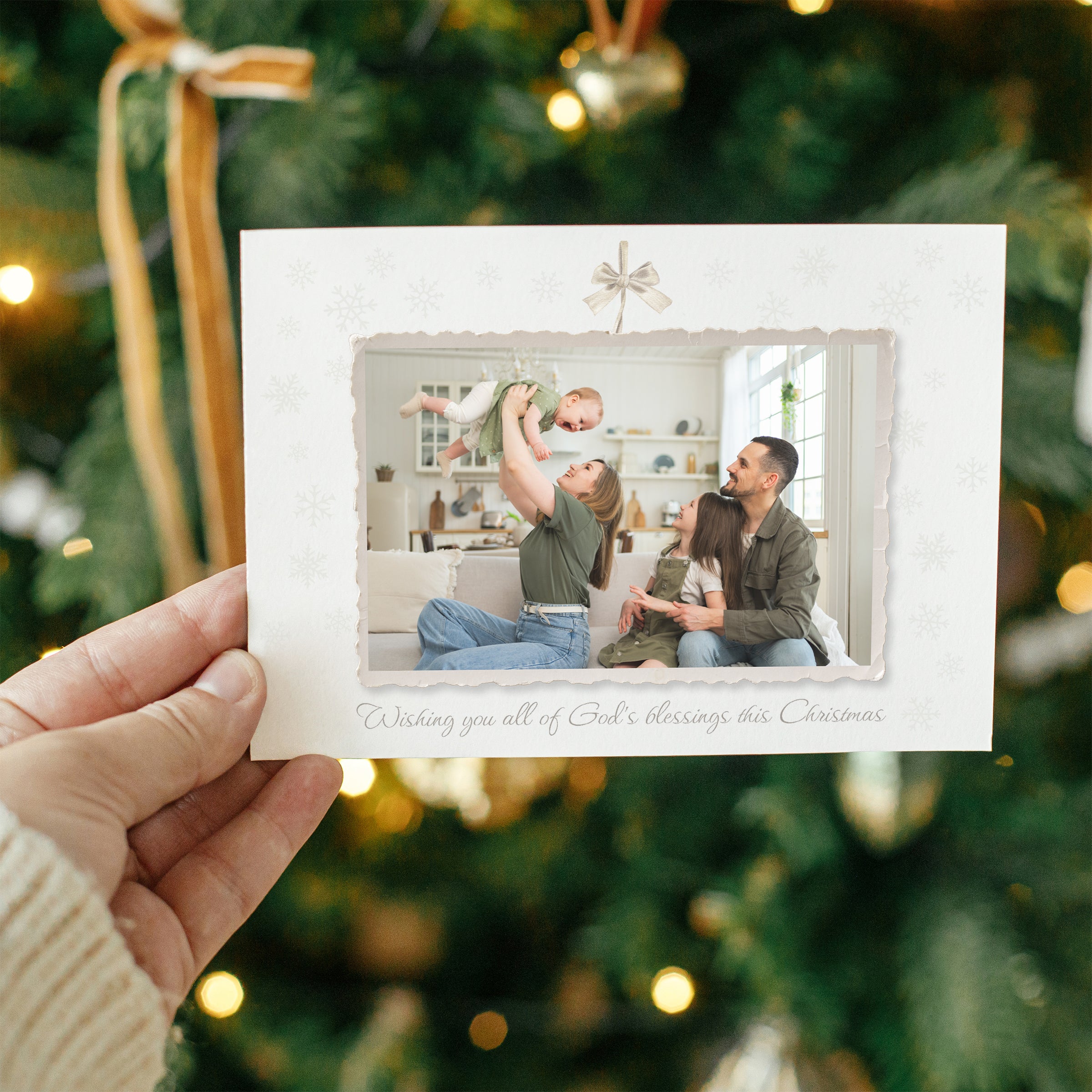 Ivory Christmas card with family photo, snowflake pattern, and frayed edges.