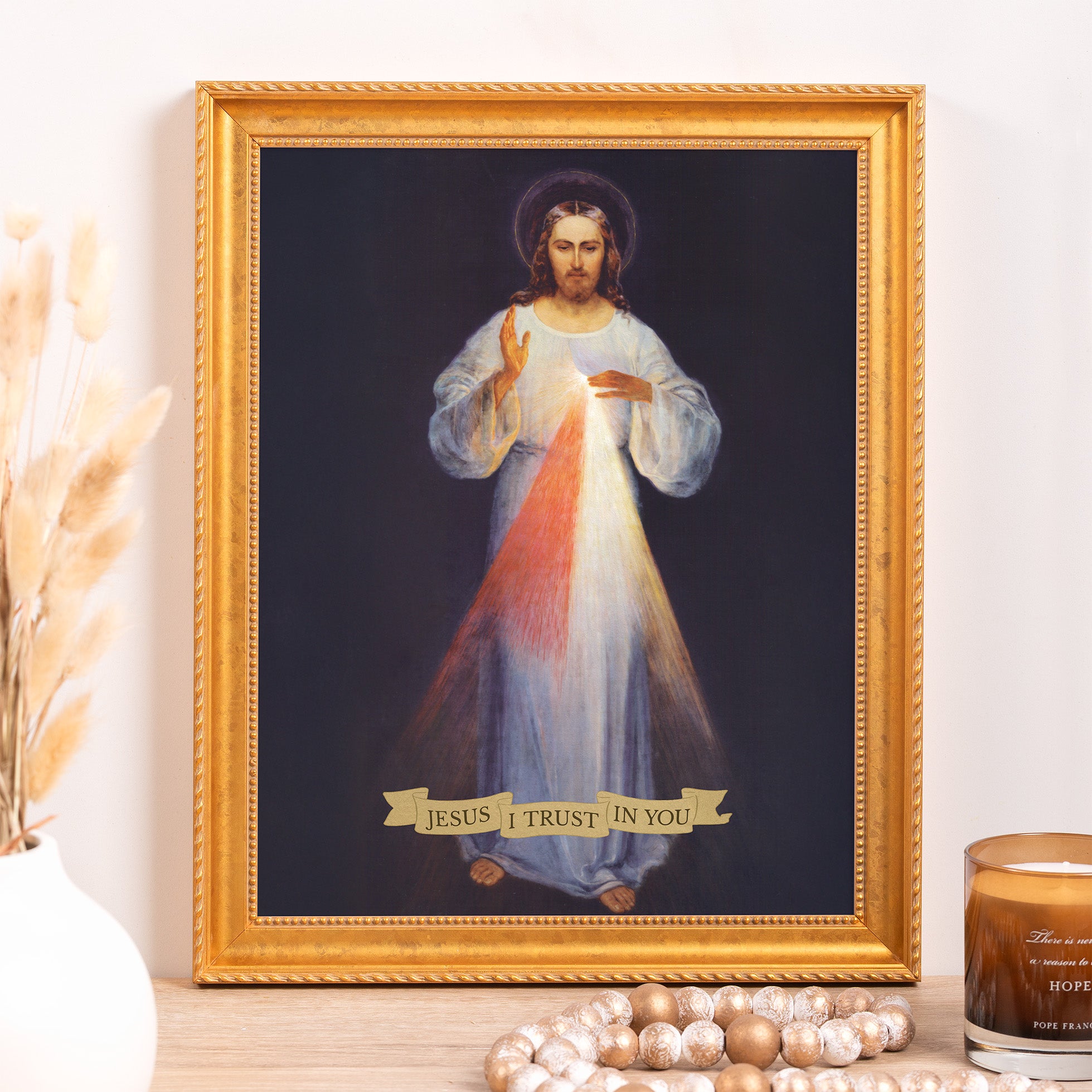 Framed "Jesus I Trust In You" print, gold frame, traditional style.