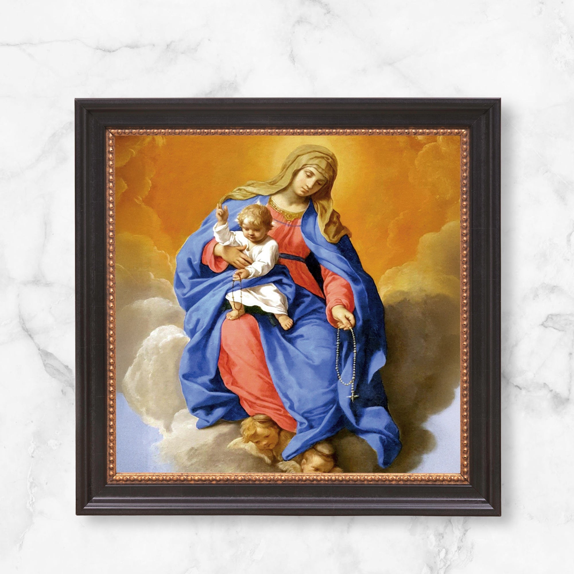 Framed painting of Virgin Mary with baby Jesus. The frame is dark wood with a gold border.