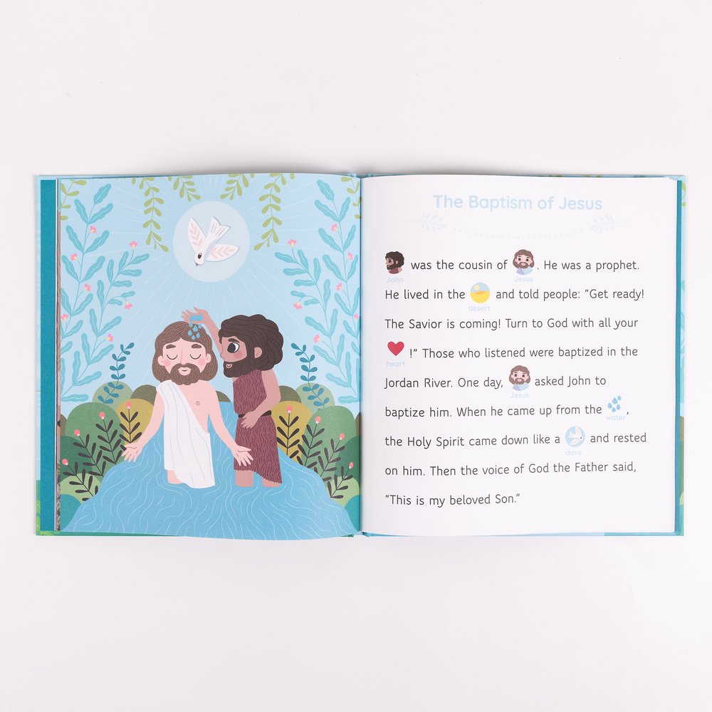 Open children's book featuring "The Baptism of Jesus" with colorful illustrations of Jesus and John in the water.