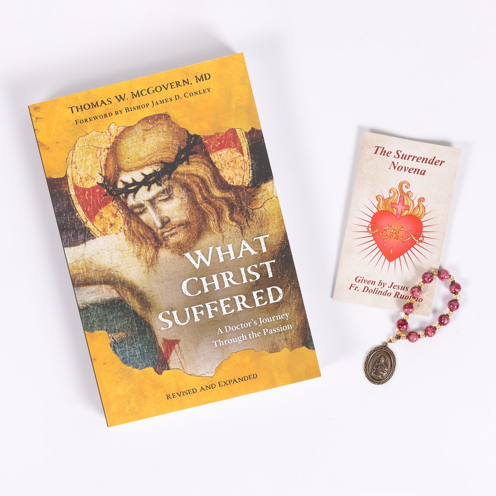 Catholic book, "What Christ Suffered," pamphlet, and rosary with pink beads and metal medal.