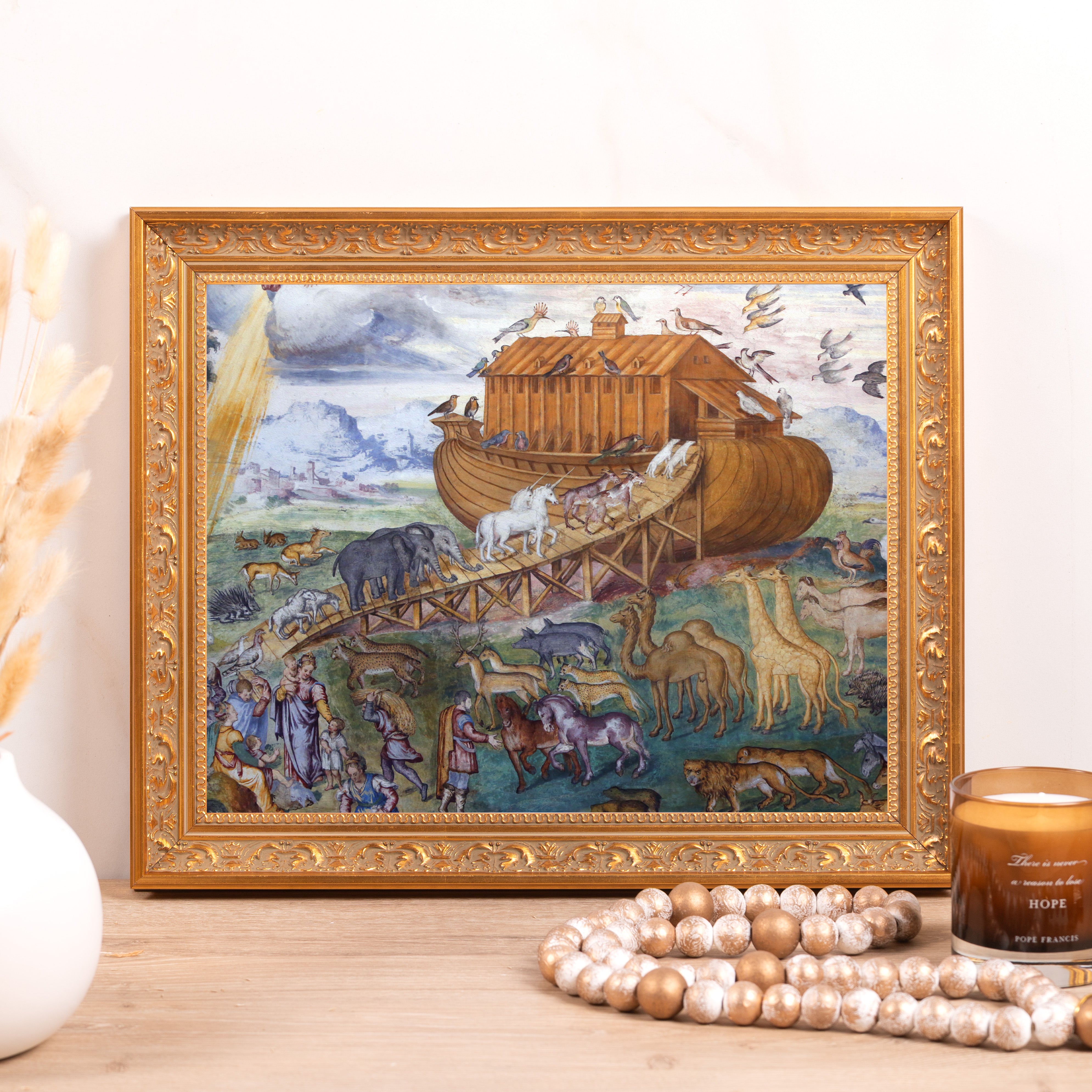 Framed Print of Noah's Ark with animals, in a decorative gold frame.