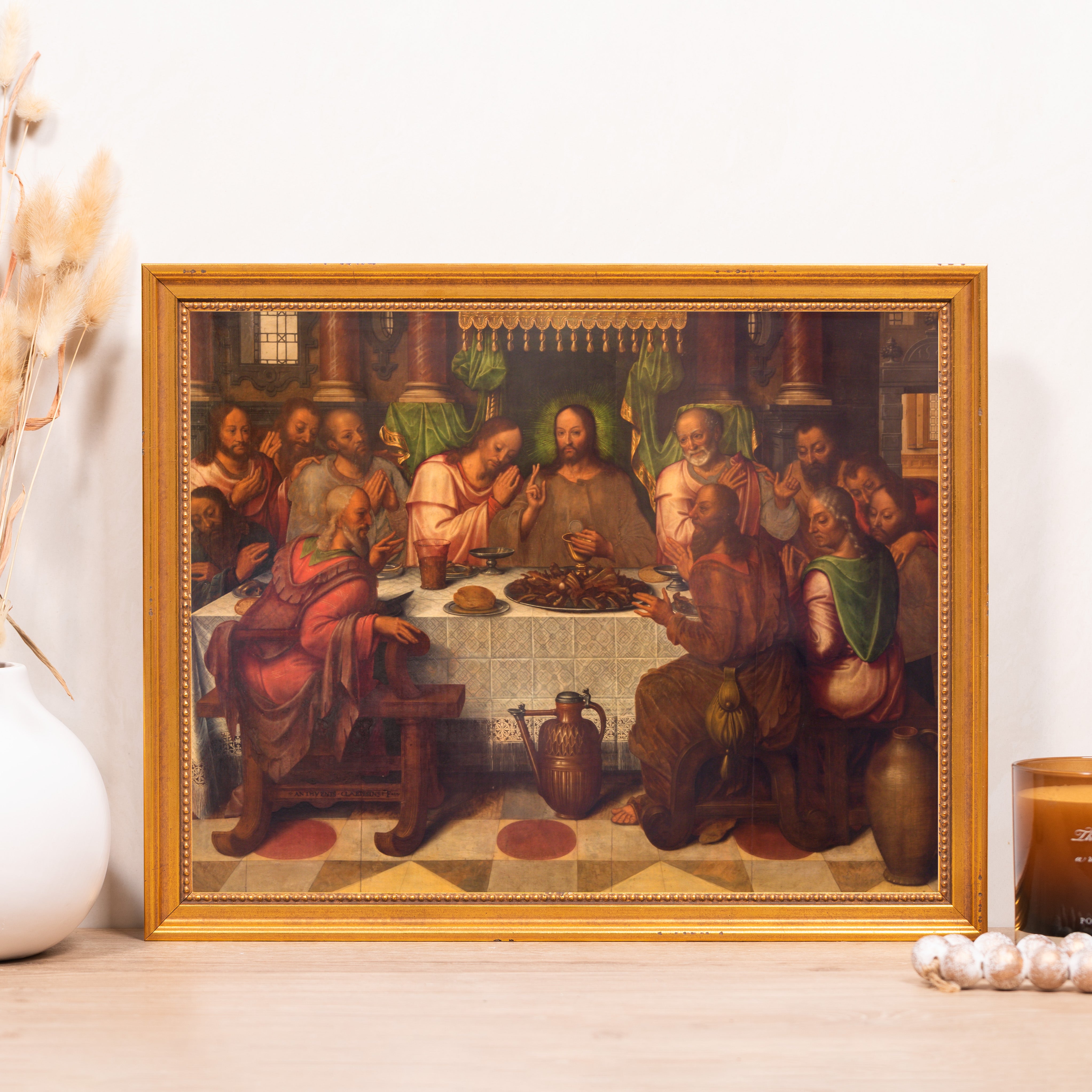 Framed "Last Supper" print with a golden wooden frame, depicting the biblical scene.