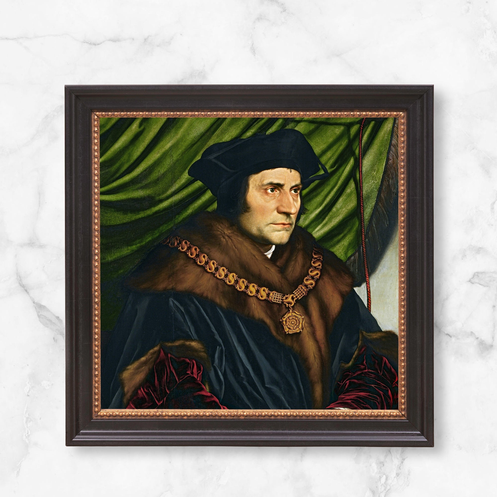 Framed portrait of Thomas More wearing a fur-trimmed black gown and gold chain, against green drapery.