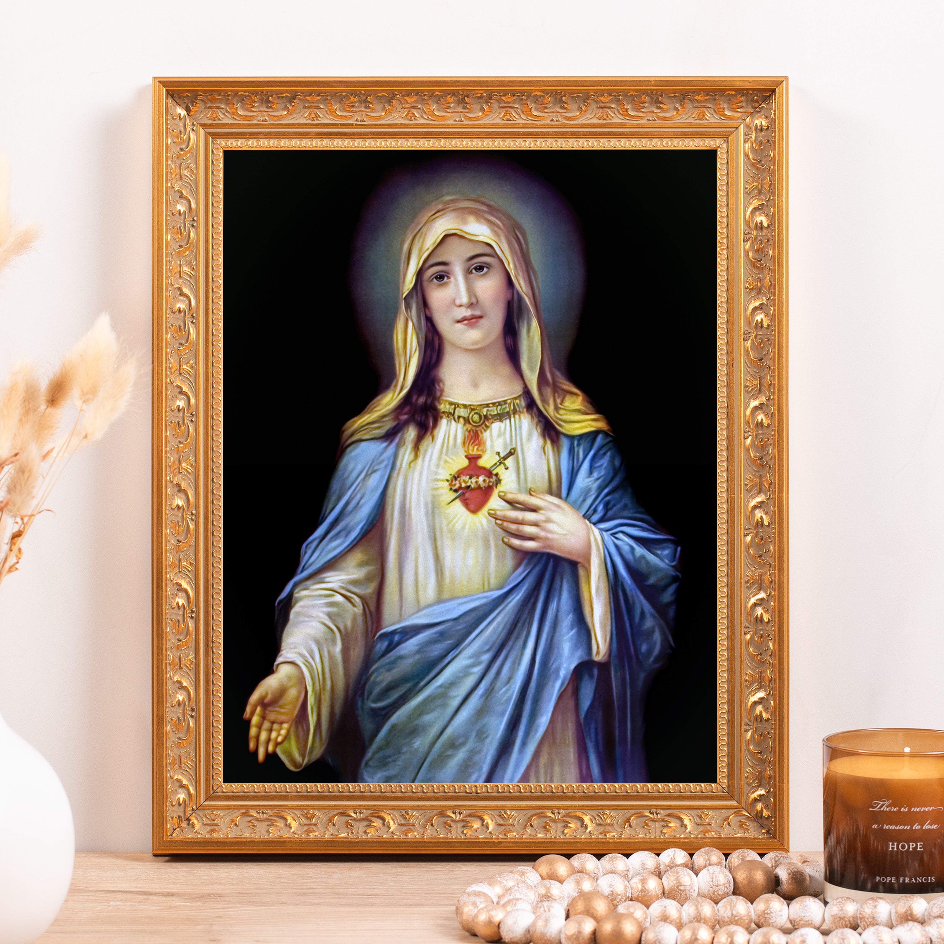 Religious Virgin Mary art print in ornate gold frame with dark background and blue robe.