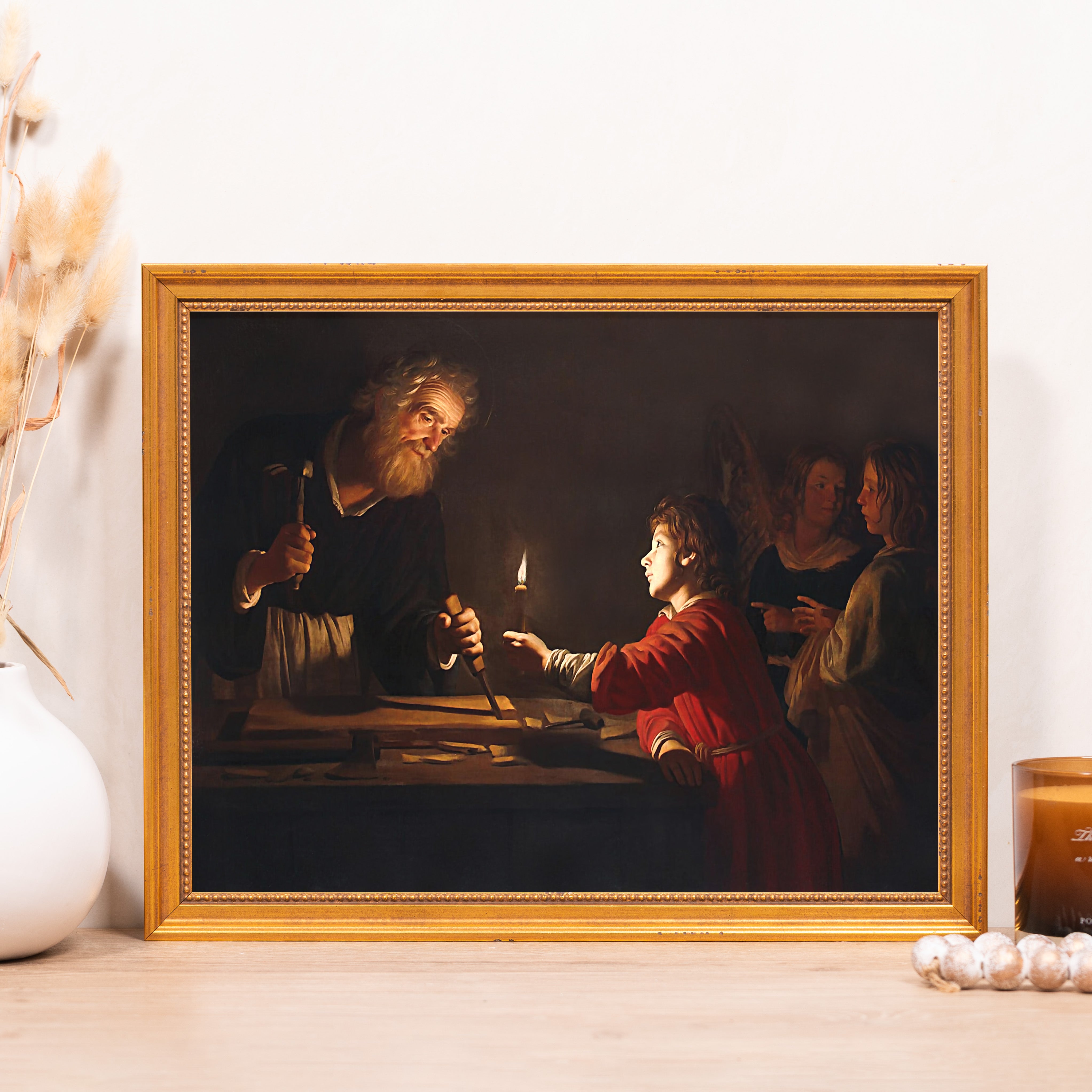 Framed reproduction print. "Saint Joseph the Carpenter" by Georges de la Tour in a gold frame.