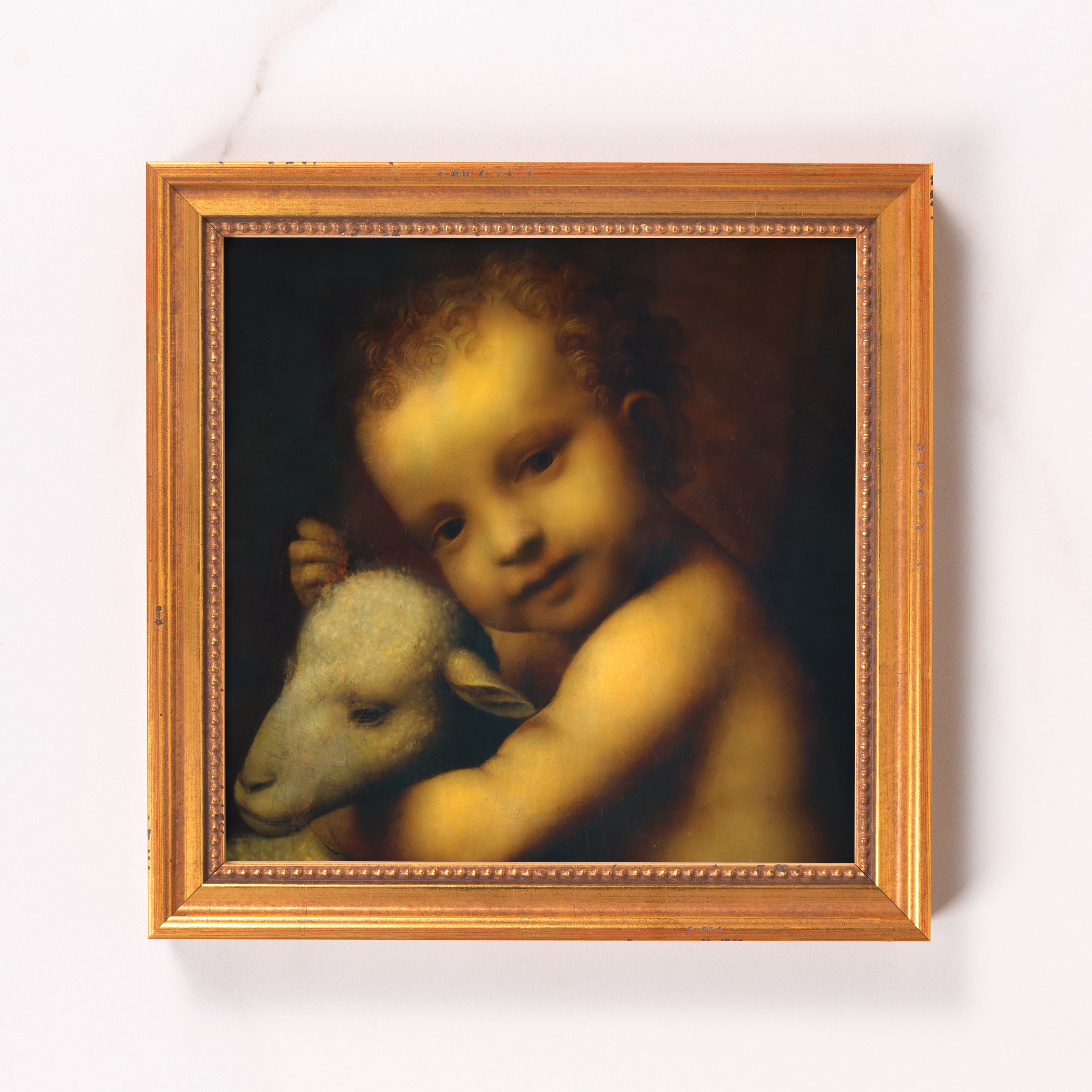 Framed painting of child hugging a sheep, in a tarnished gold frame.