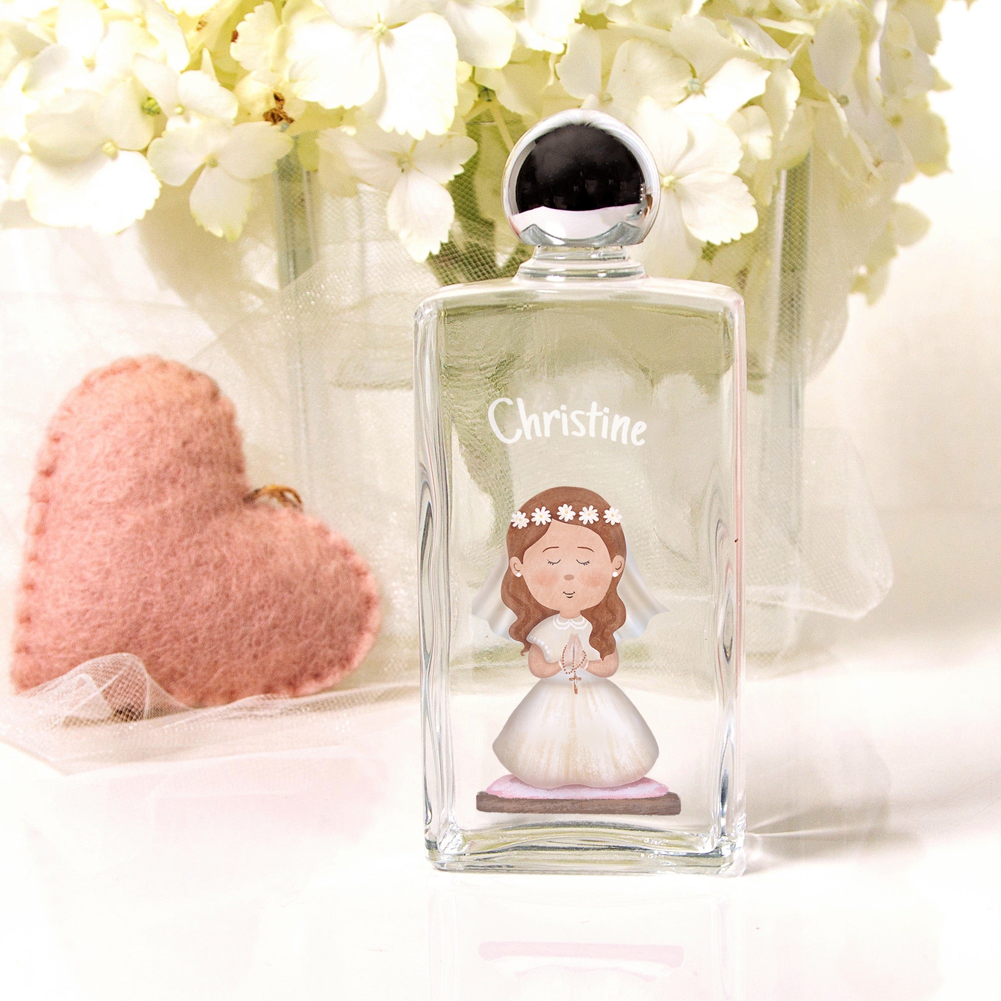 Personalized Glass bottle with chrome cap, features communion girl graphic and name.
