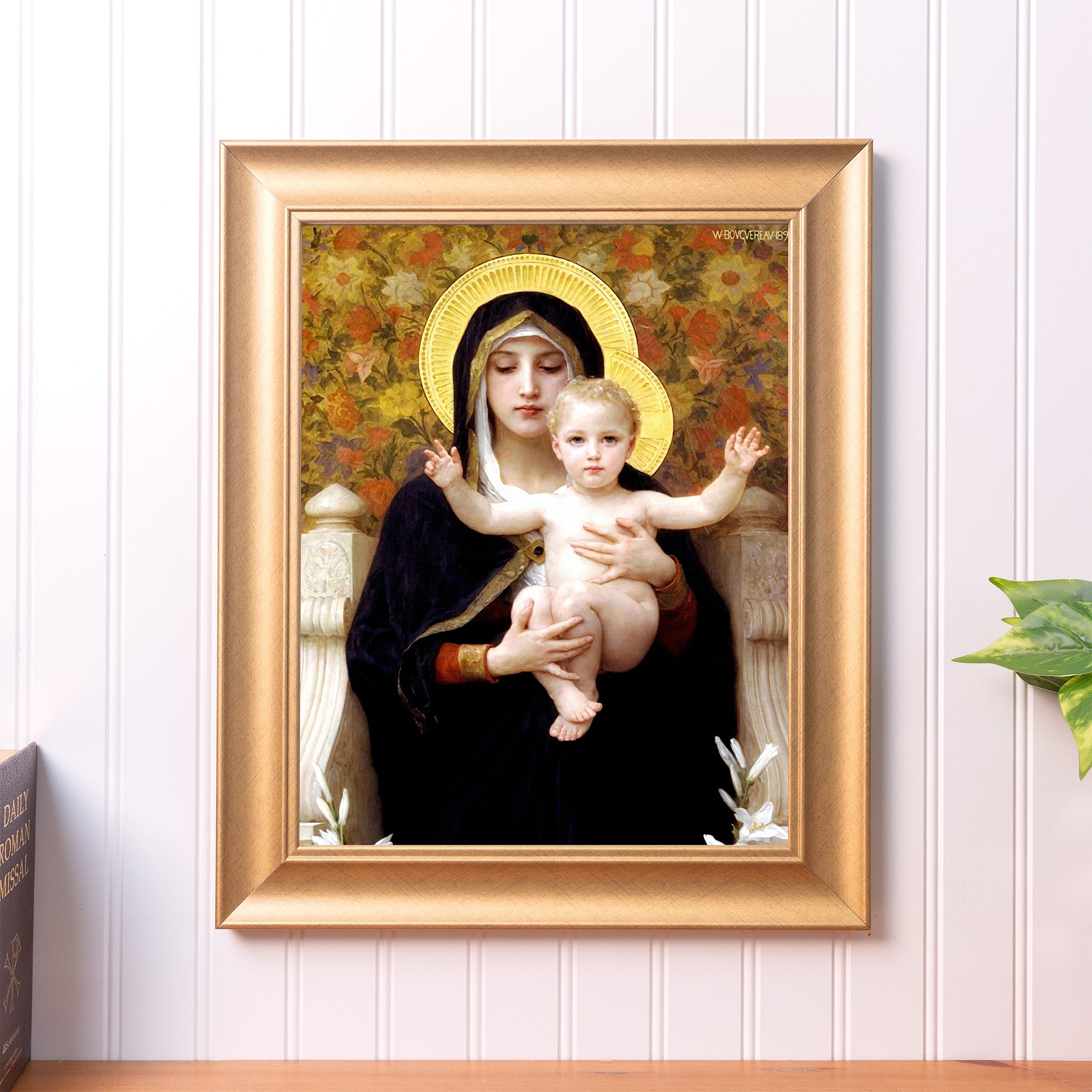 Framed "Madonna of the Flowers" print. Renaissance-style art with a gold frame depicts Mary and baby Jesus with floral background.