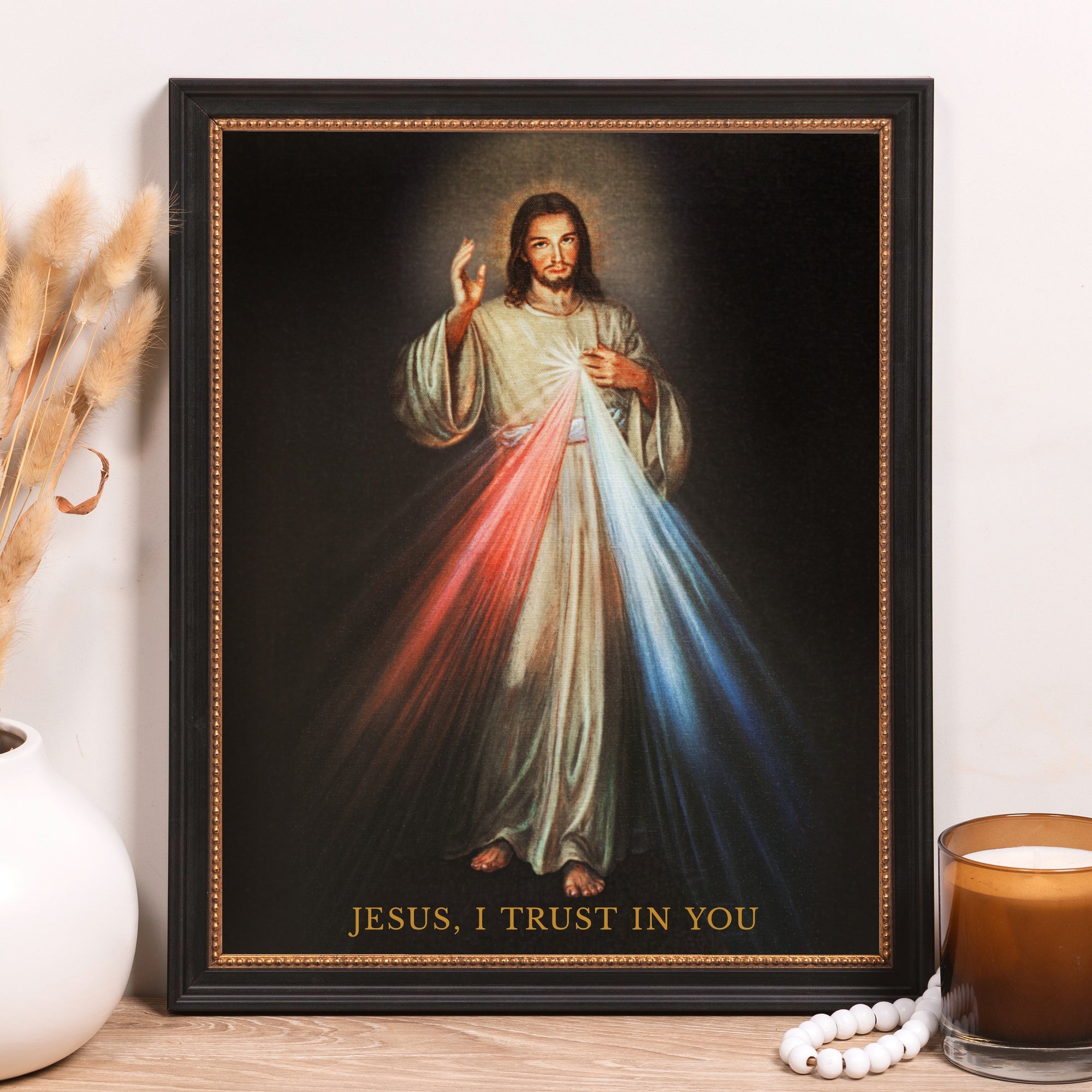 Framed print of the Divine Mercy with Jesus and red and blue rays.