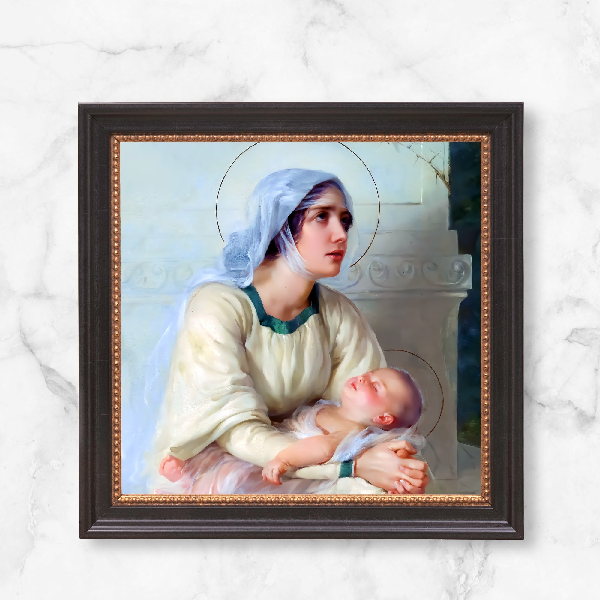 Framed Painting of Mary holding baby Jesus; traditional style, dark wood frame.