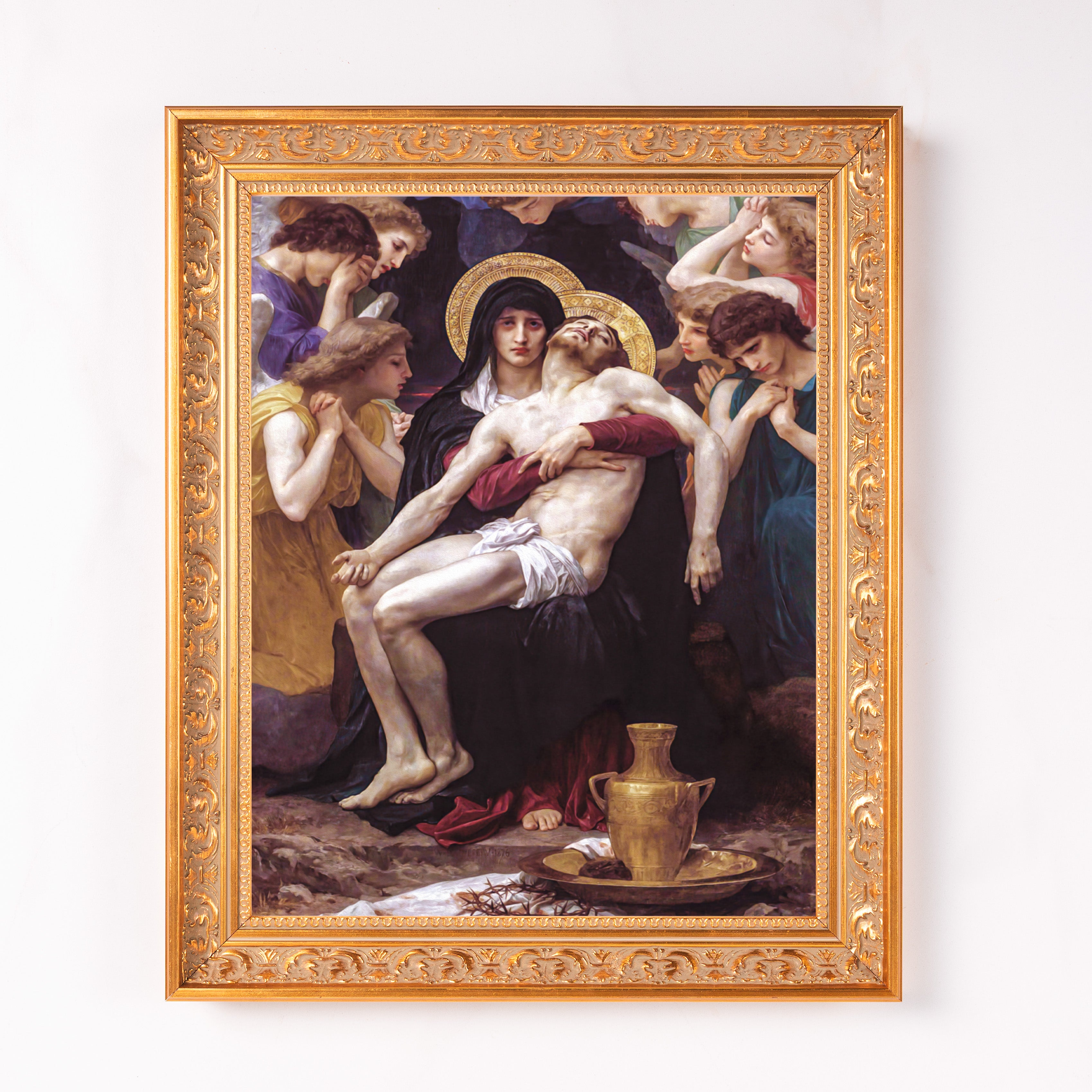 Framed oil painting depicts the Pieta with a golden frame.