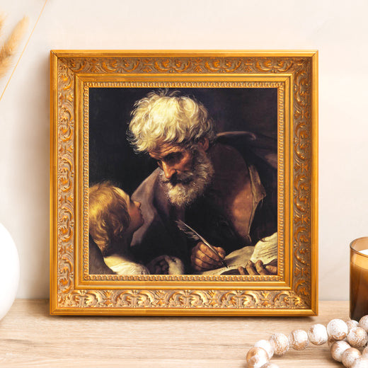 Framed reproduction of Rembrandt's "St. Peter Writing," with a gold ornate wood frame; wall decor.