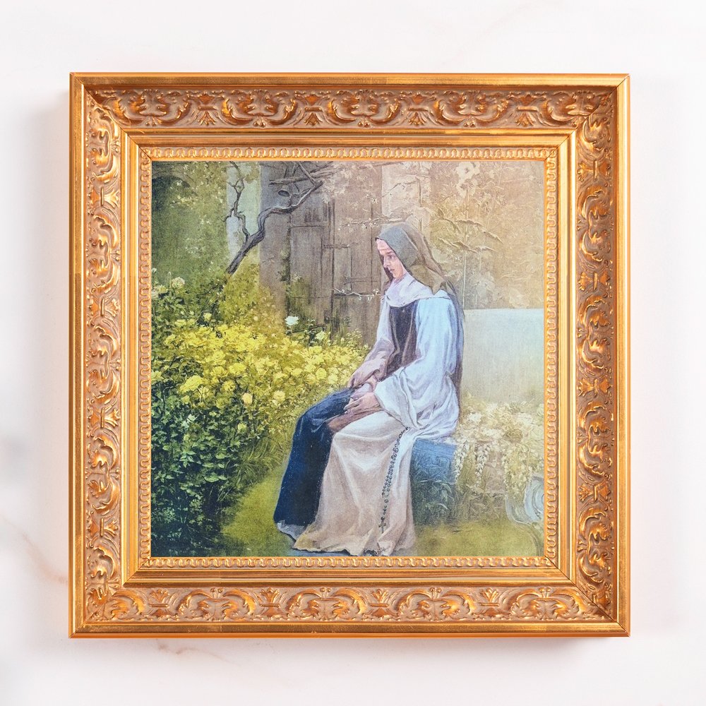 Framed canvas print showing a seated nun in a garden with a golden ornate frame.
