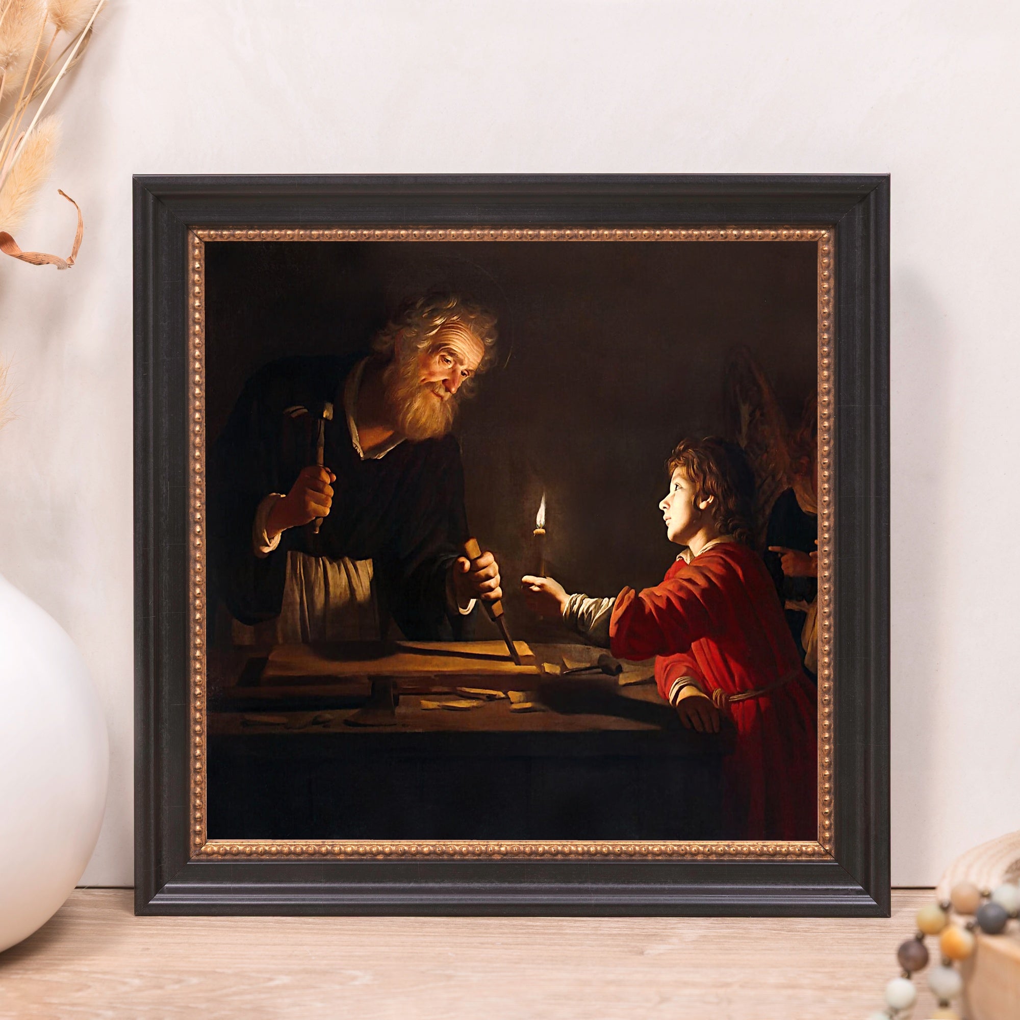 Framed painting of Joseph and Jesus, oil on canvas with dark ornate frame.