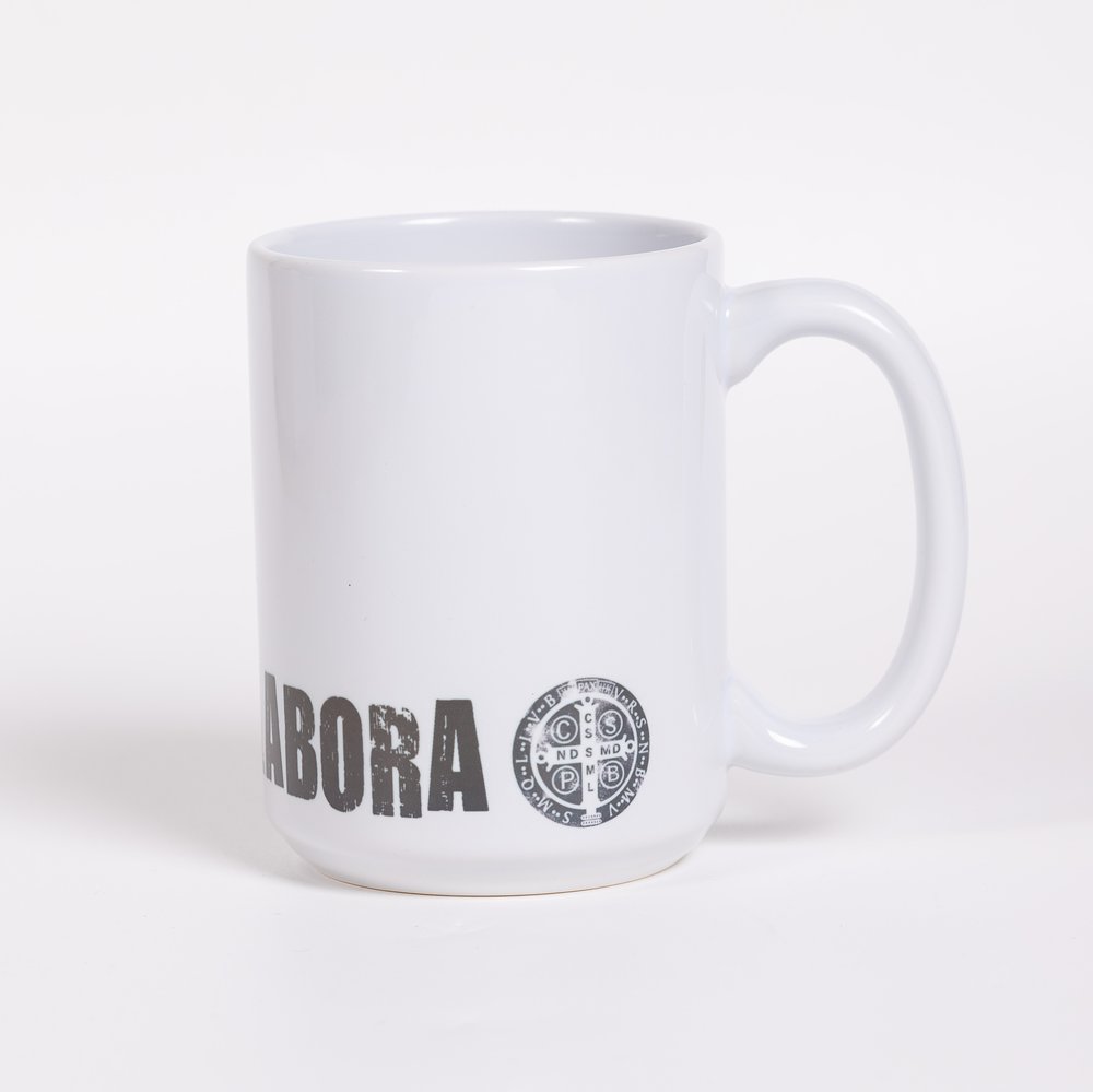 White, ceramic coffee mug with "Labora" text and a circular symbol printed on it.