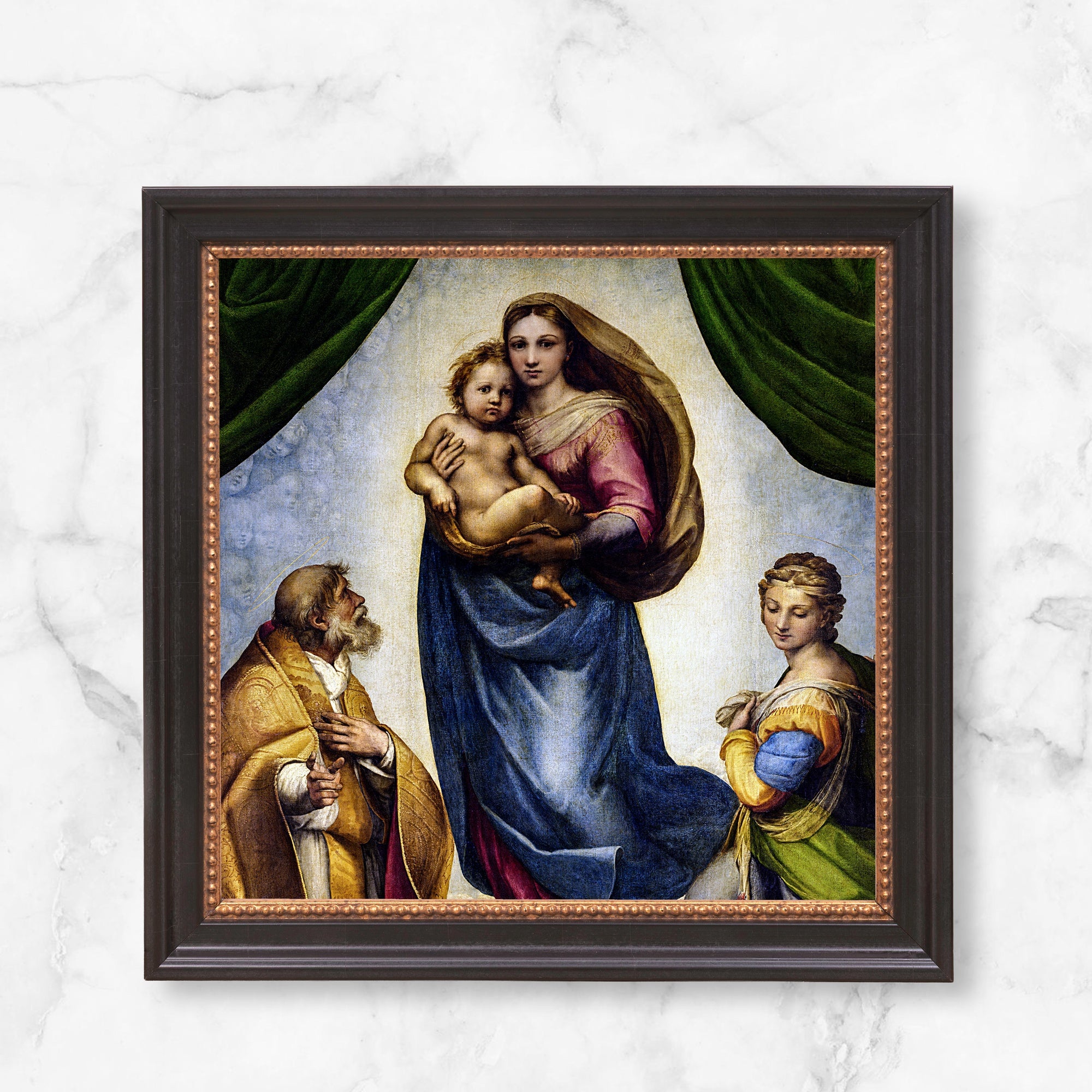 Framed Raphael's Sistine Madonna wall art reproduction with brown frame and classic style.