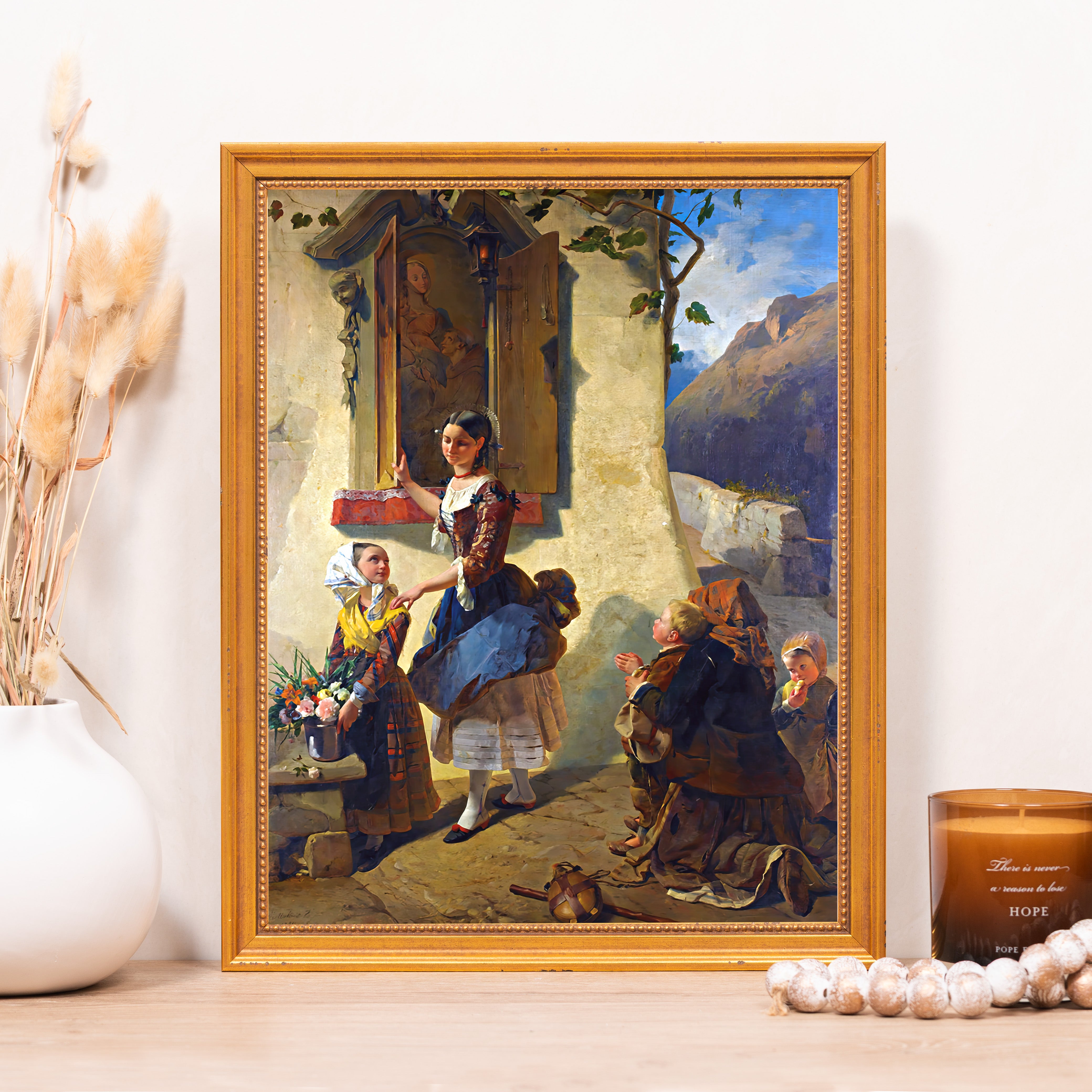 Framed artwork: Oil painting of woman interacting with children, in a gold frame.
