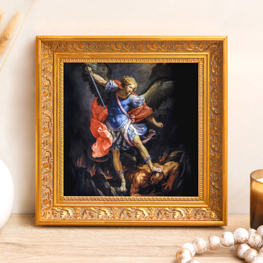 Framed painting shows St. Michael vanquishing Satan in a carved gold frame.