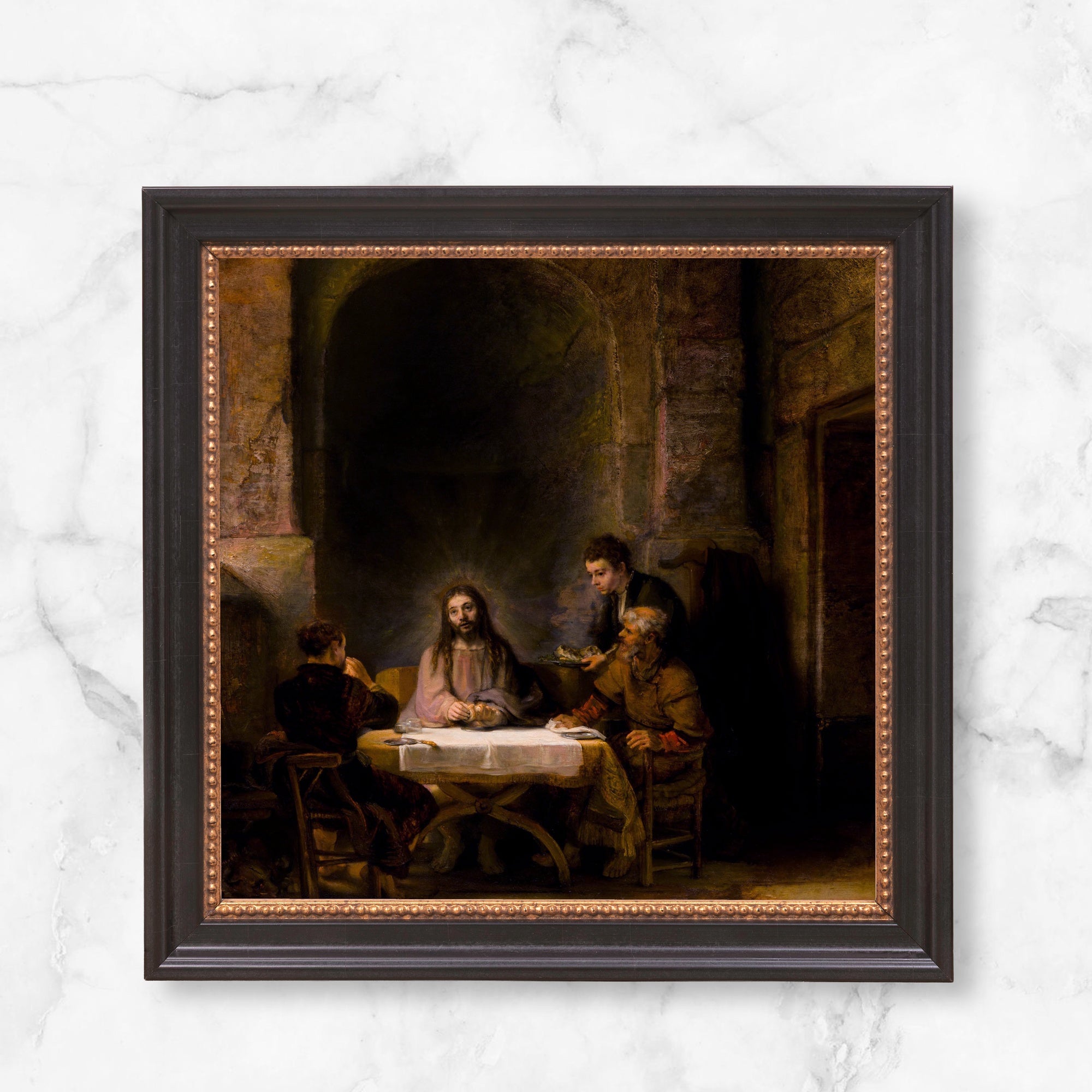 Framed Fine art print of the last supper with a dark wood frame and metallic trim.